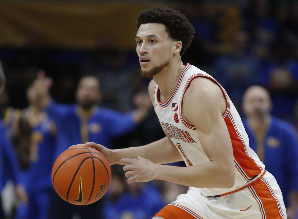 Jan 18, 2025; Pittsburgh, Pennsylvania, USA; Clemson Tigers guard Chase Hunter (1) dribbles the ball against the Pittsburgh Panthers during the second half at the Petersen Events Center. Mandatory Credit: Charles LeClaire-Imagn Images
