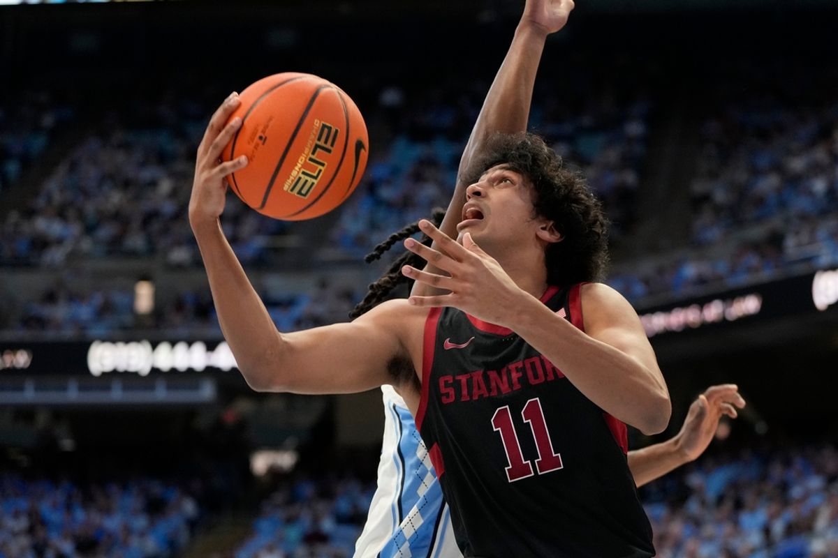 Jan 18, 2025; Chapel Hill, North Carolina, USA; Stanford Cardinal guard Ryan Agarwal (11) shoots as North Carolina Tar Heels forward Jae'Lyn Withers (24) defends in the first half at Dean E. Smith Center. Mandatory Credit: Bob Donnan-Imagn Images