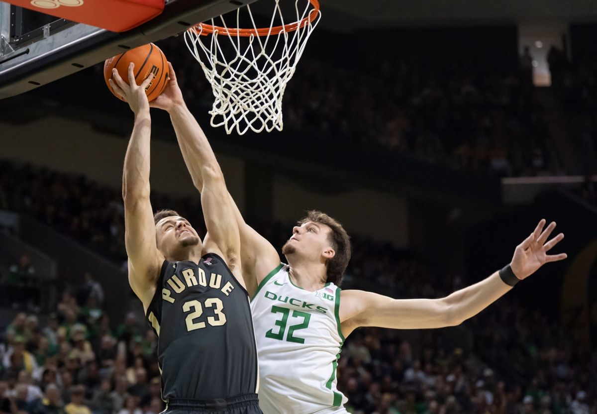 Oregon center Nate Bittle, right, blocks a shot by Purdue forward Camden Heide as the Oregon Ducks host the Purdue Boilermakers Saturday, Jan. 18, 2025, at Matthew Knight Arena in Eugene, Ore.