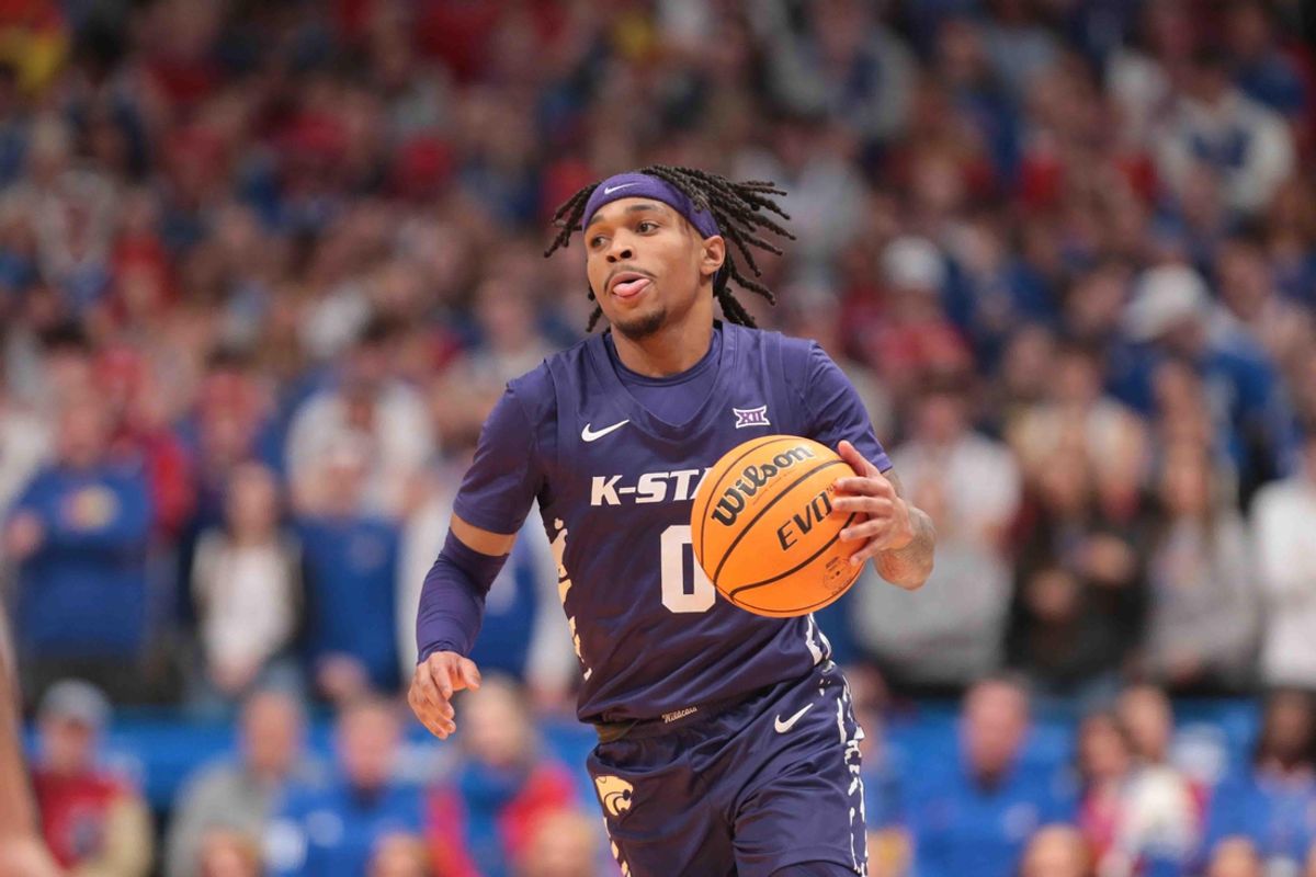 Kansas State Wildcats guard Dug McDaniel (0) dribbles down court against the Kansas Jayhawks in the second half of the Sunflower Showdown game inside Allen Fieldhouse Saturday, Jan. 18, 2025.