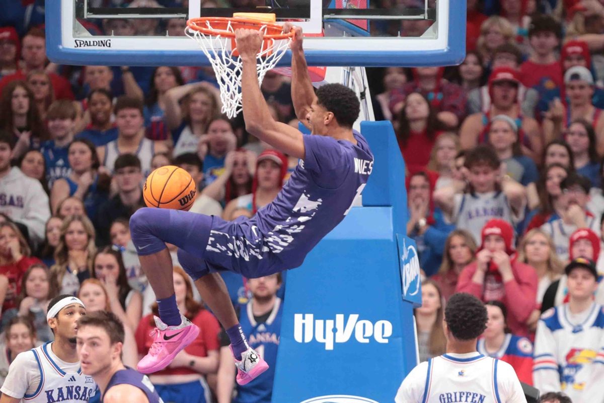 Kansas State Wildcats guard David N'Guessan (1) dunks over Kansas Jayhawks in the first half of the Sunflower Showdown game inside Allen Fieldhouse Saturday, Jan. 18, 2025.