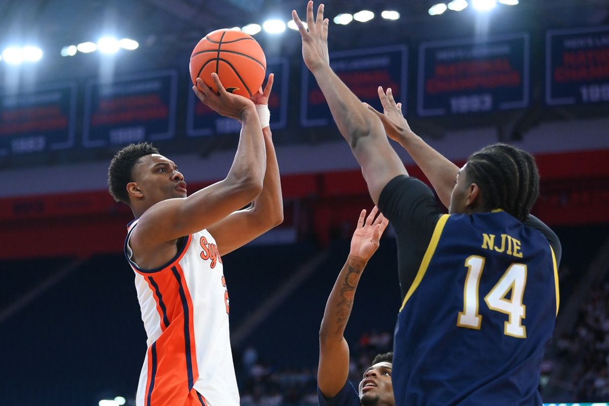 Jan 18, 2025; Syracuse, New York, USA; Syracuse Orange guard J.J. Starling (2) shoots against Notre Dame Fighting Irish forward Kebba Njie (14) during the first half at the JMA Wireless Dome. Mandatory Credit: Rich Barnes-Imagn Images