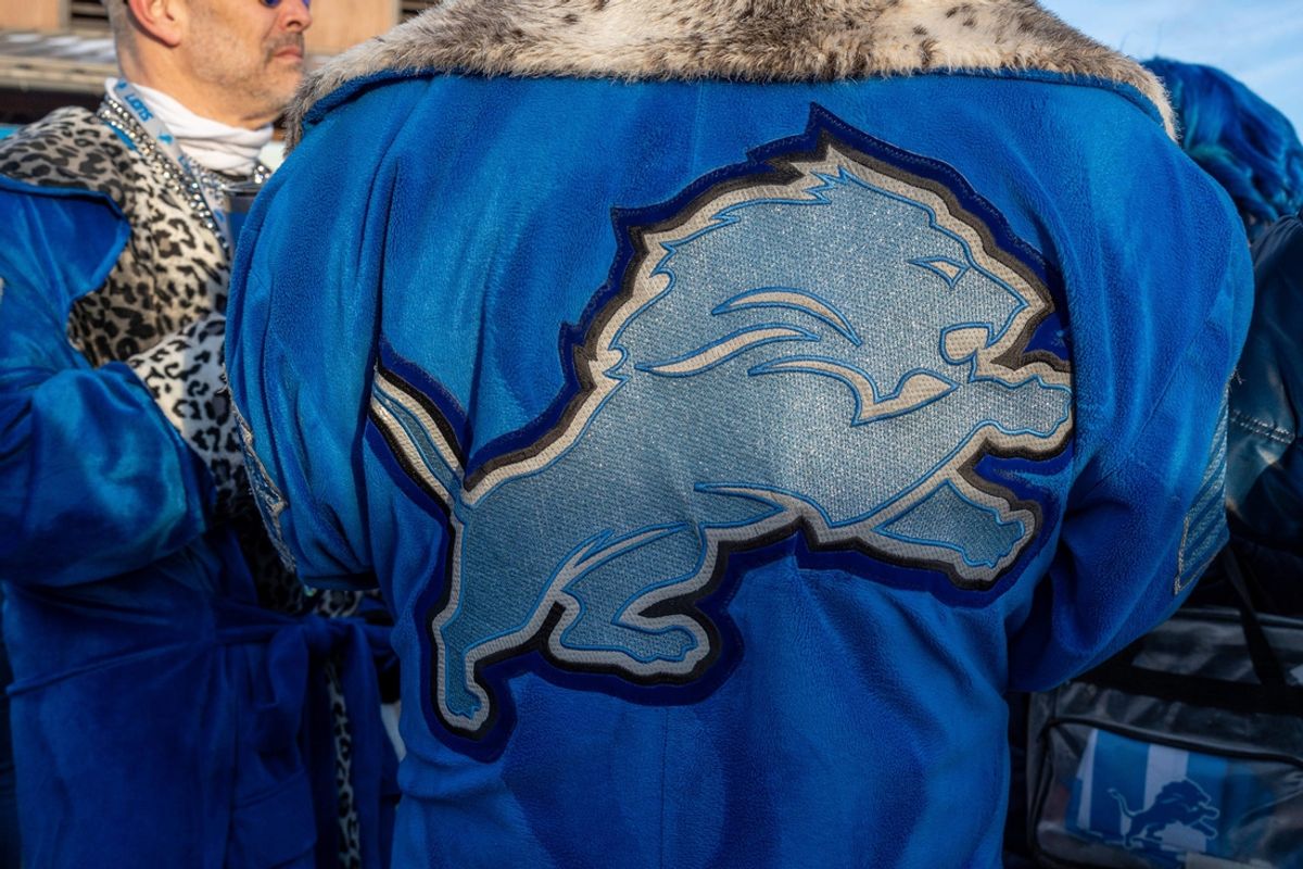 A Detroit Lions fan wears a robe with the Lions logo on it during a tailgate at Eastern Market before the Lions vs. Washington Commanders playoff game in Detroit on Saturday, Jan. 18, 2025.