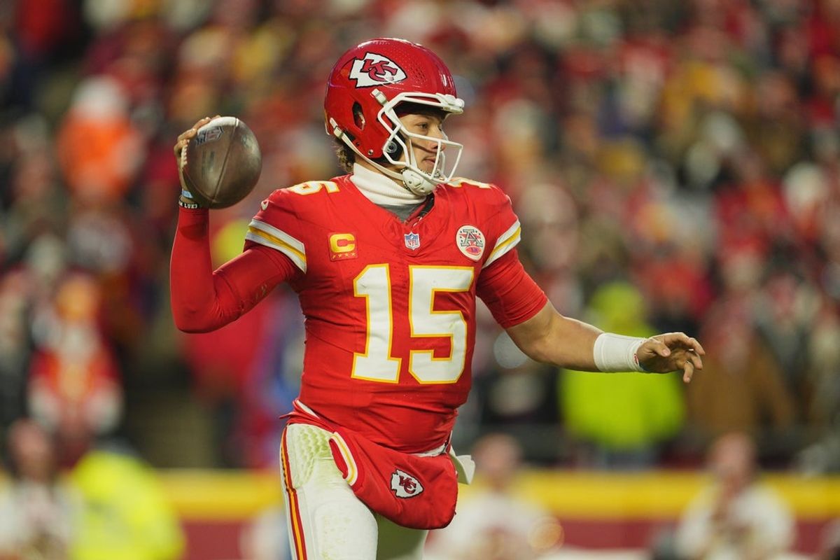 Jan 18, 2025; Kansas City, Missouri, USA; Kansas City Chiefs quarterback Patrick Mahomes (15) rolls out to throw against the Houston Texans during the third quarter of a 2025 AFC divisional round game at GEHA Field at Arrowhead Stadium. Mandatory Credit: Jay Biggerstaff-Imagn Images