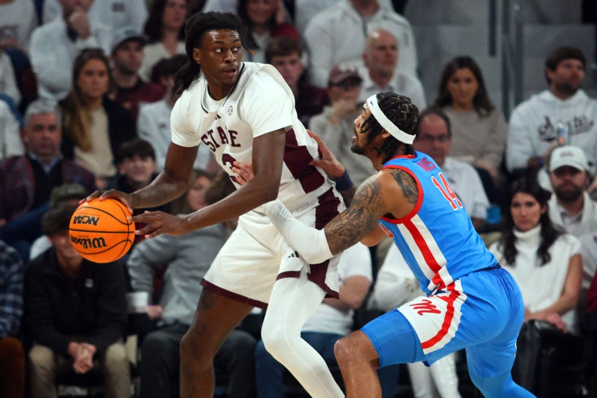 Jan 18, 2025; Starkville, Mississippi, USA; Mississippi State Bulldogs forward KeShawn Murphy (3) handles the ball against Mississippi Rebels guard Dre Davis (14) during the first half at Humphrey Coliseum. Mandatory Credit: Petre Thomas-Imagn Images