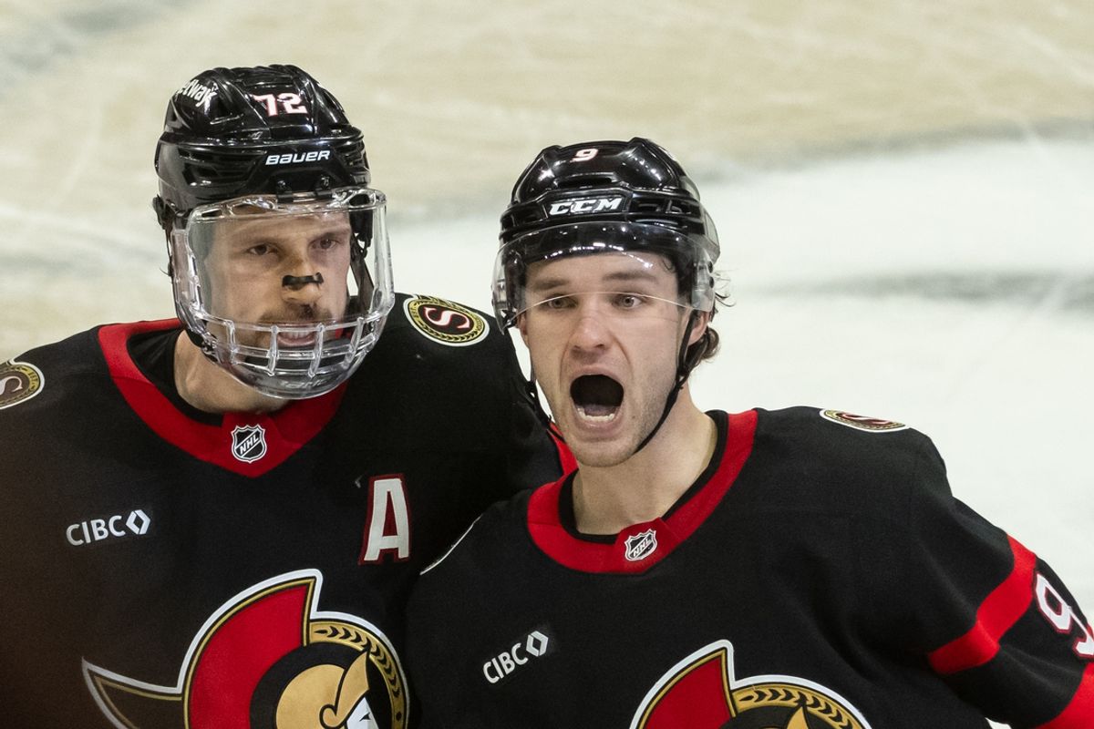 Jan 18, 2025; Ottawa, Ontario, CAN; Ottawa Senators center Josh Norris (9) celebrates with defenseman Thomas Chabot (72) his goal scored to tie the game in the third period and extend into overtime at the Canadian Tire Centre. Mandatory Credit: Marc DesRosiers-Imagn Images