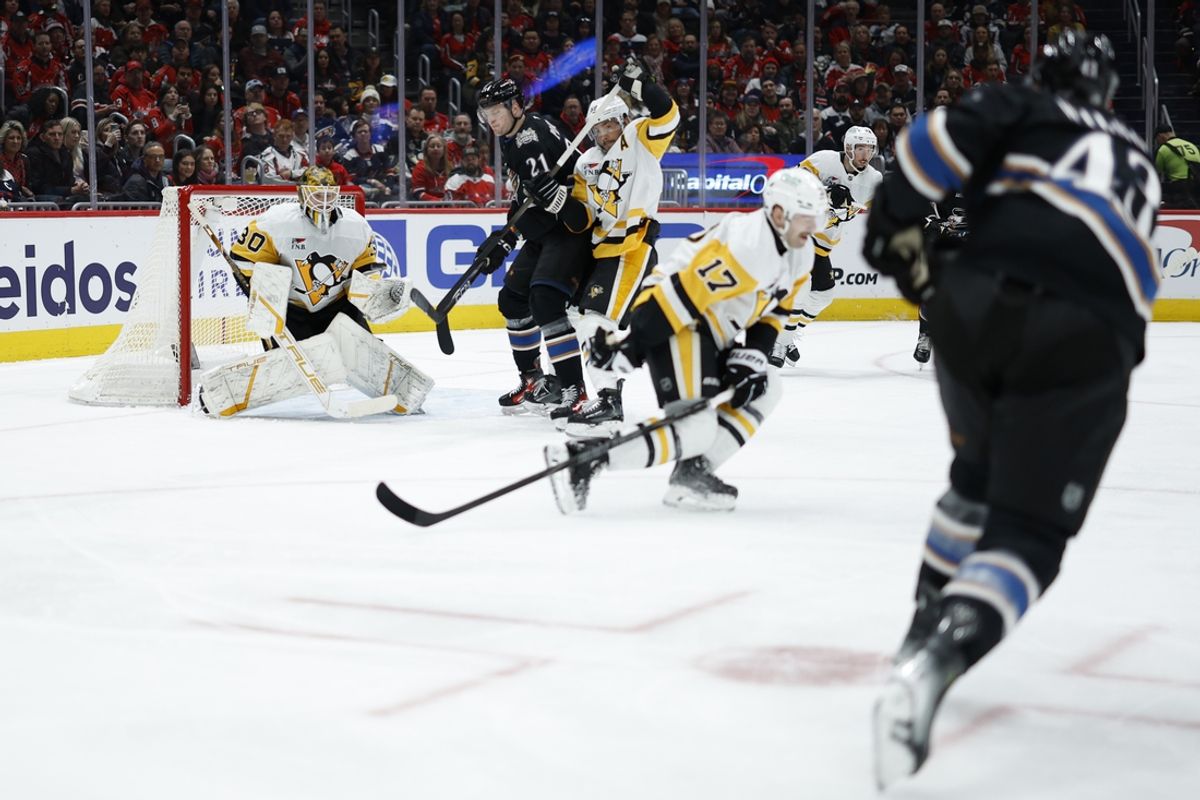 Jan 18, 2025; Washington, District of Columbia, USA; Pittsburgh Penguins goaltender Joel Blomqvist (30) prepares to make a save on Washington Capitals right wing Tom Wilson (43) in the first period at Capital One Arena. Mandatory Credit: Geoff Burke-Imagn Images