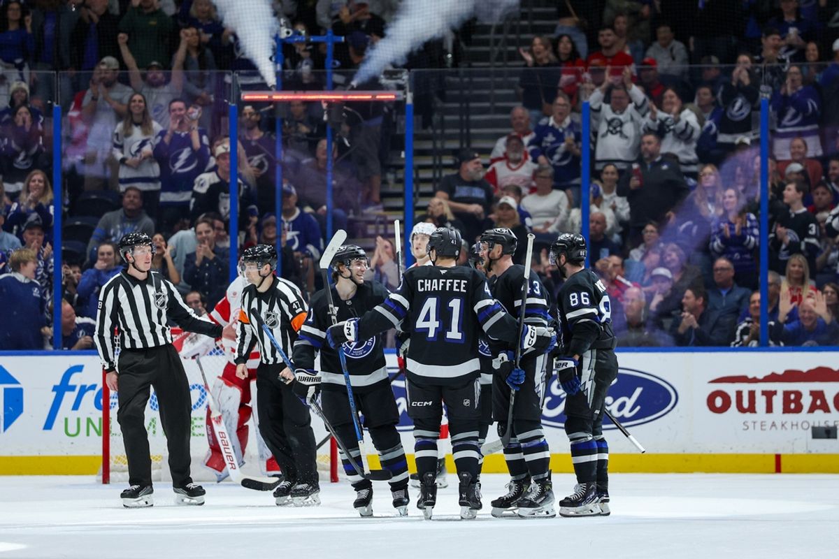 Jan 18, 2025; Tampa, Florida, USA; Tampa Bay Lightning defenseman Darren Raddysh (43) celebrates with right wing Mitchell Chaffee (41) after scoring a goal against the Detroit Red Wings in the second period at Amalie Arena. Mandatory Credit: Nathan Ray Seebeck-Imagn Images