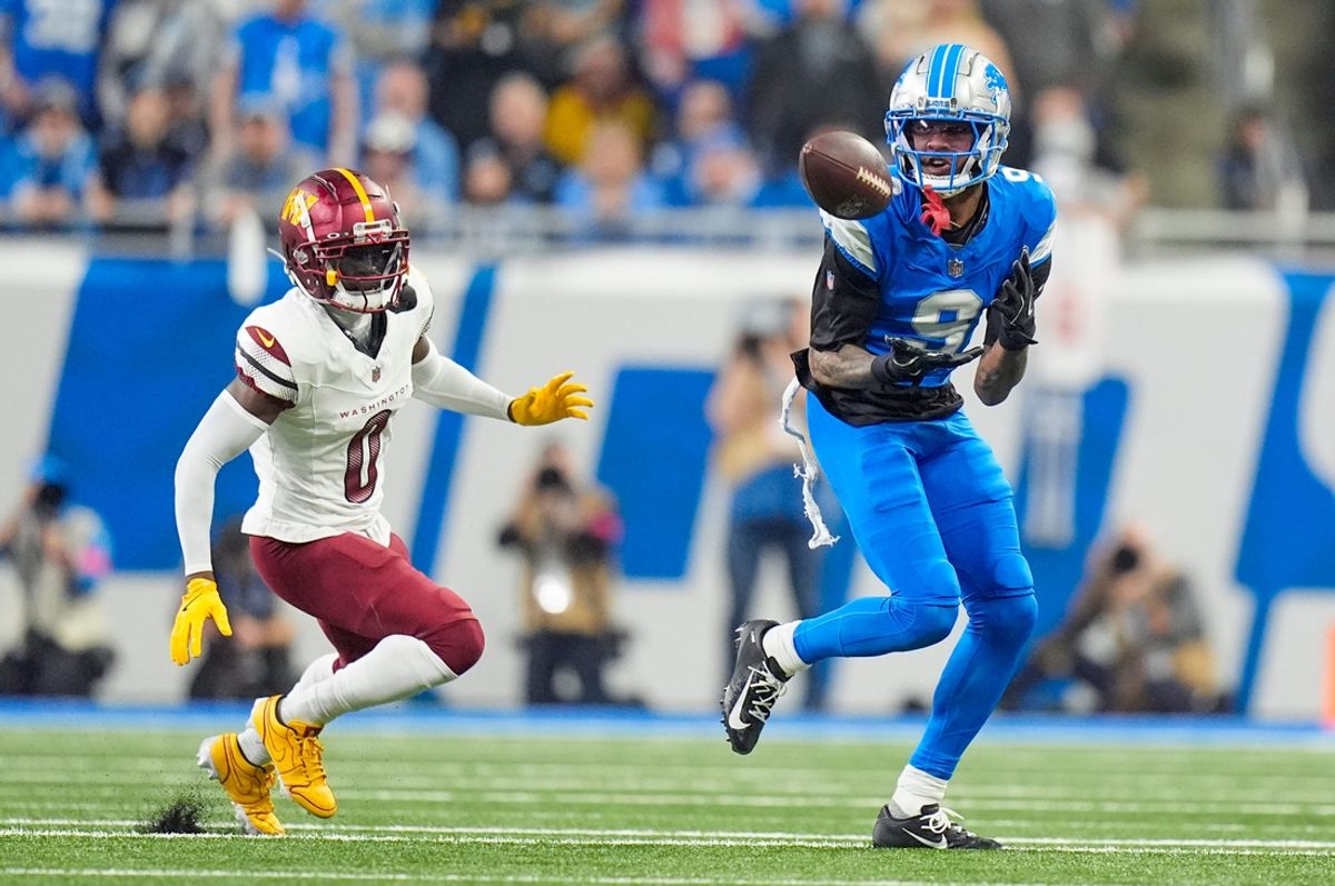 Detroit Lions wide receiver Jameson Williams (9) looks to catch the ball around Washington Commanders cornerback Mike Sainristil (0) in the first quarter against the Detroit Lions in the NFC divisional round at Ford Field in Detroit on Saturday, Jan. 18, 2025.