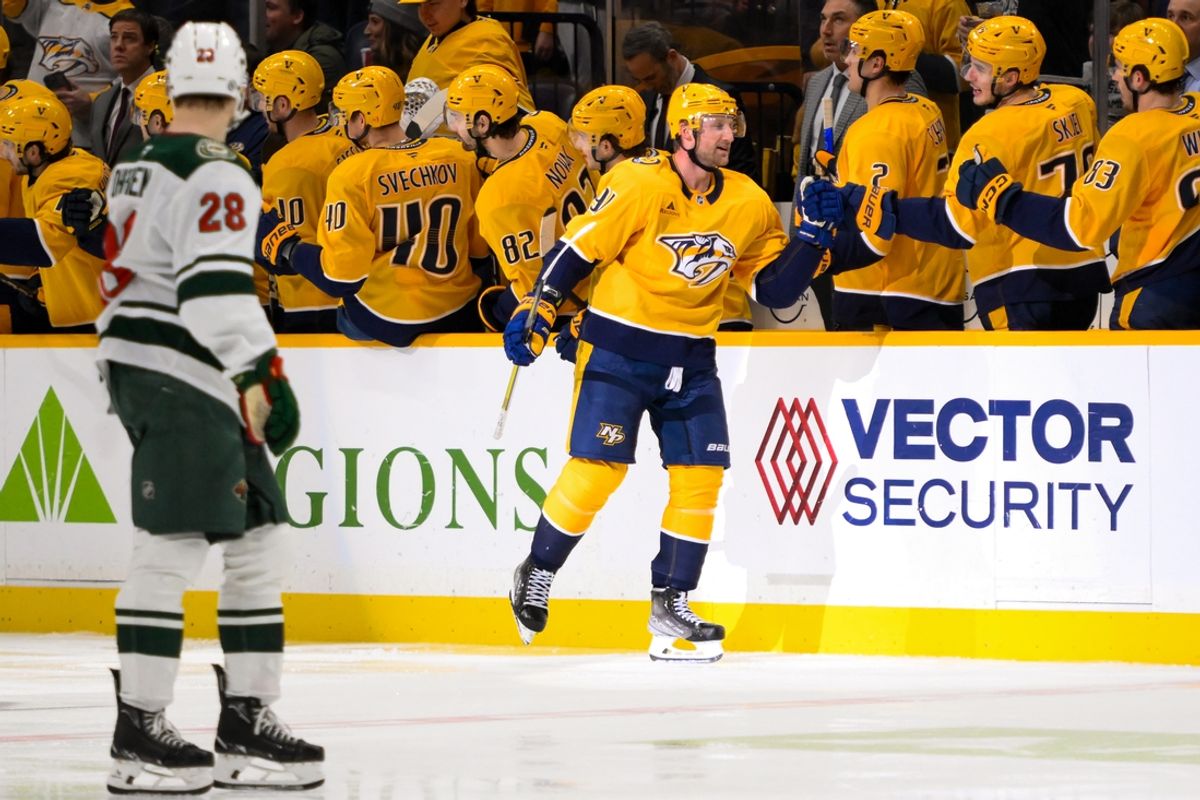 Jan 18, 2025; Nashville, Tennessee, USA;  Nashville Predators center Steven Stamkos (91) celebrates his goal with his teammates  against the Minnesota Wild during the second period at Bridgestone Arena. Mandatory Credit: Steve Roberts-Imagn Images