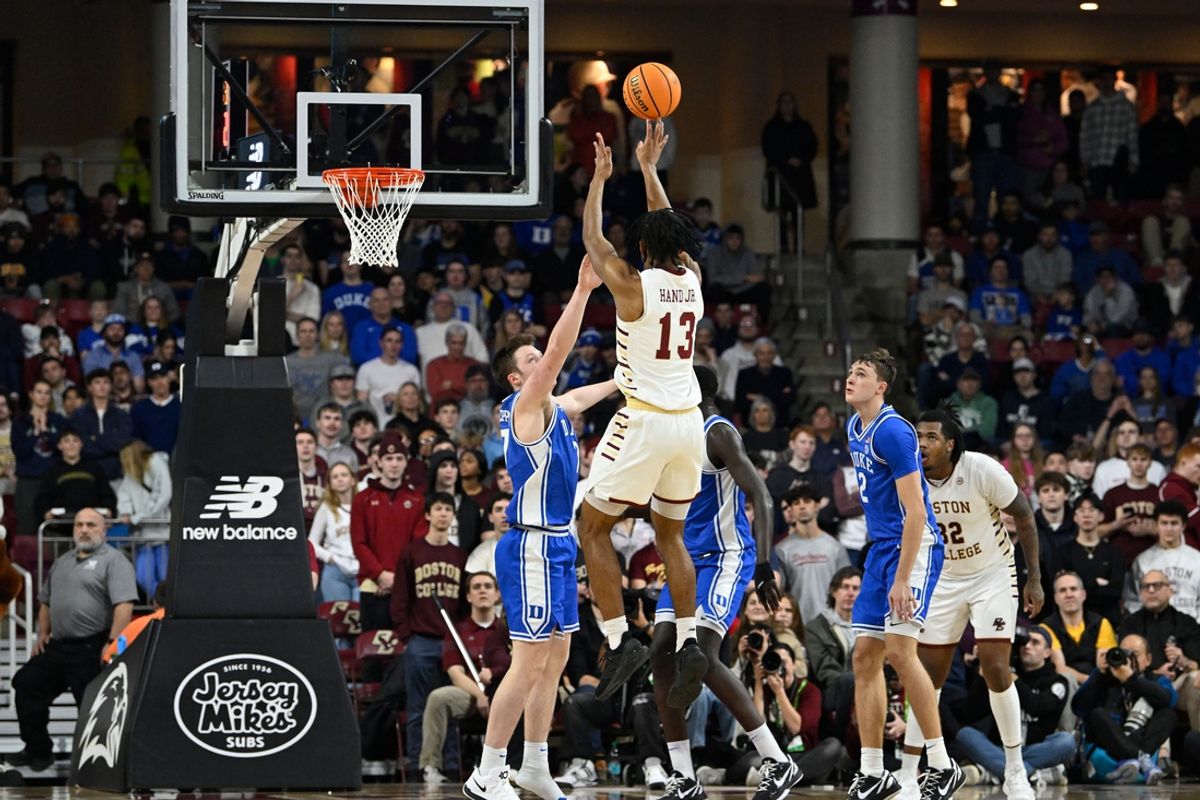 Jan 18, 2025; Chestnut Hill, Massachusetts, USA; Boston College Eagles guard Donald Hand Jr. (13) shoots over Duke Blue Devils guard Kon Knueppel (7) during the second half at Conte Forum. Mandatory Credit: Eric Canha-Imagn Images
