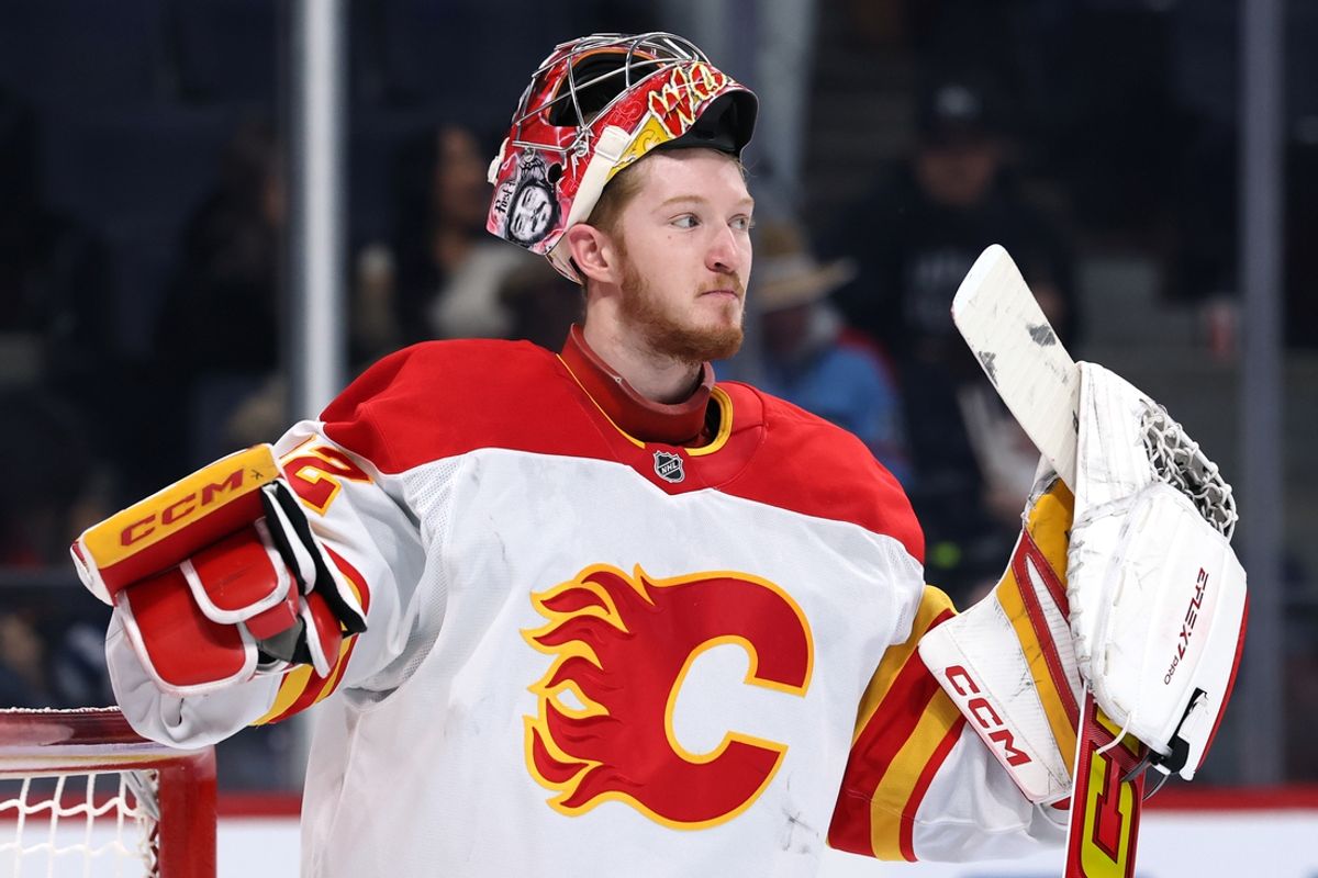 Jan 18, 2025; Winnipeg, Manitoba, CAN; Calgary Flames goaltender Dustin Wolf (32) during a break in play against the Winnipeg Jets during the third period at Canada Life Centre. Mandatory Credit: James Carey Lauder-Imagn Images
