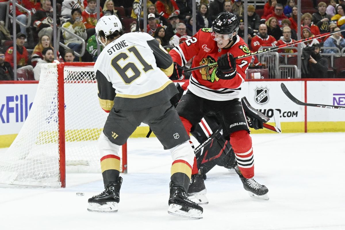 Jan 18, 2025; Chicago, Illinois, USA;  Vegas Golden Knights right wing Mark Stone (61) and Chicago Blackhawks defenseman Alex Vlasic (72) chase the puck during the first period at United Center. Mandatory Credit: Matt Marton-Imagn Images