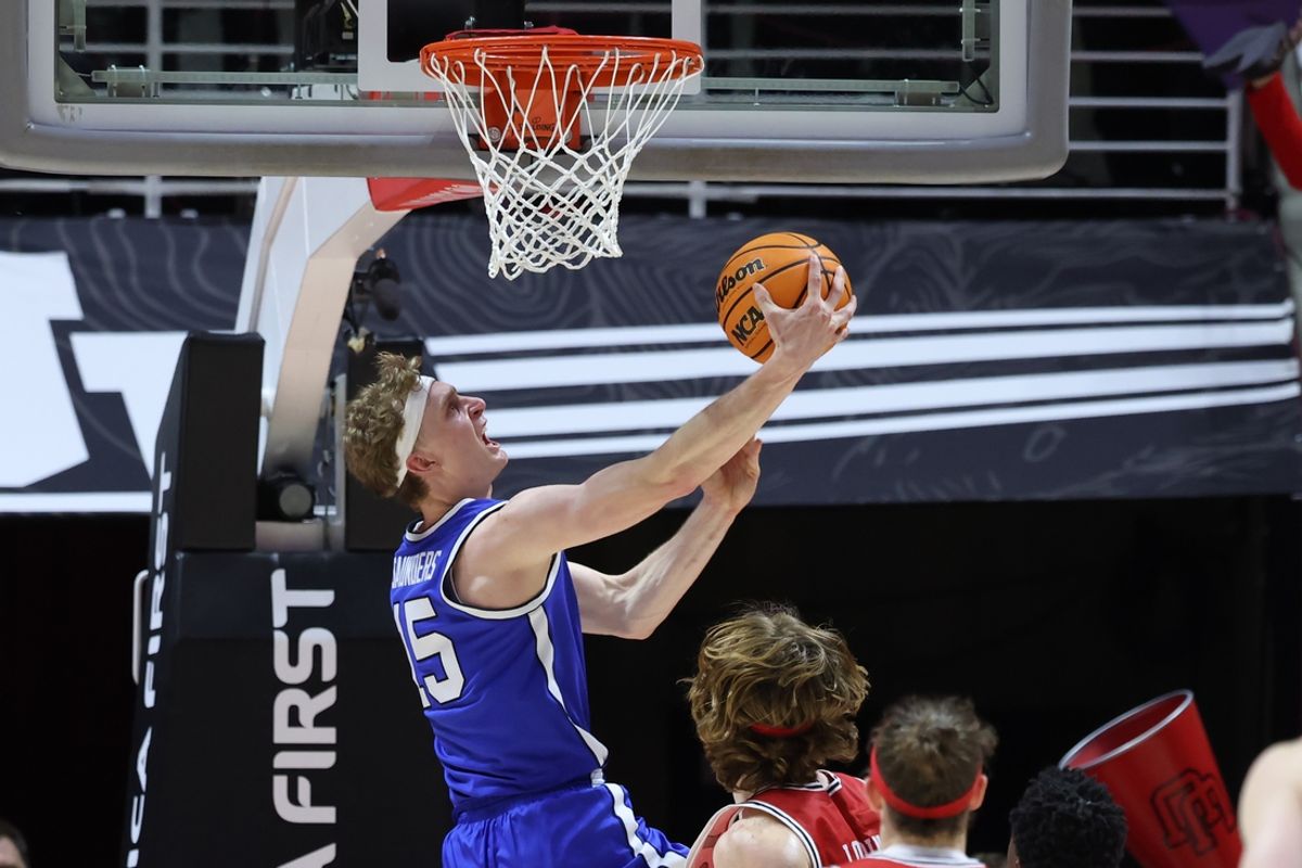 Jan 18, 2025; Salt Lake City, Utah, USA; Brigham Young Cougars forward Richie Saunders (15) lays the ball up during overtime at Jon M. Huntsman Center. Mandatory Credit: Rob Gray-Imagn Images
