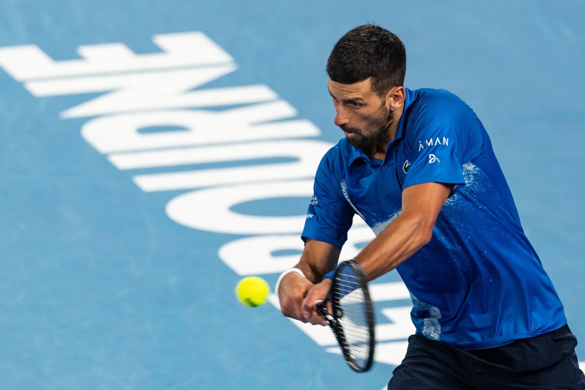 Jan 19, 2025; Melbourne, Victoria, Australia; Novak Djokovic of Serbia plays a backhand during his match against Jiri Lehecka of Czech Republic in the fourth round of the men's singles at the 2025 Australian Open at Melbourne Park. Mandatory Credit: Mike Frey-Imagn Images
