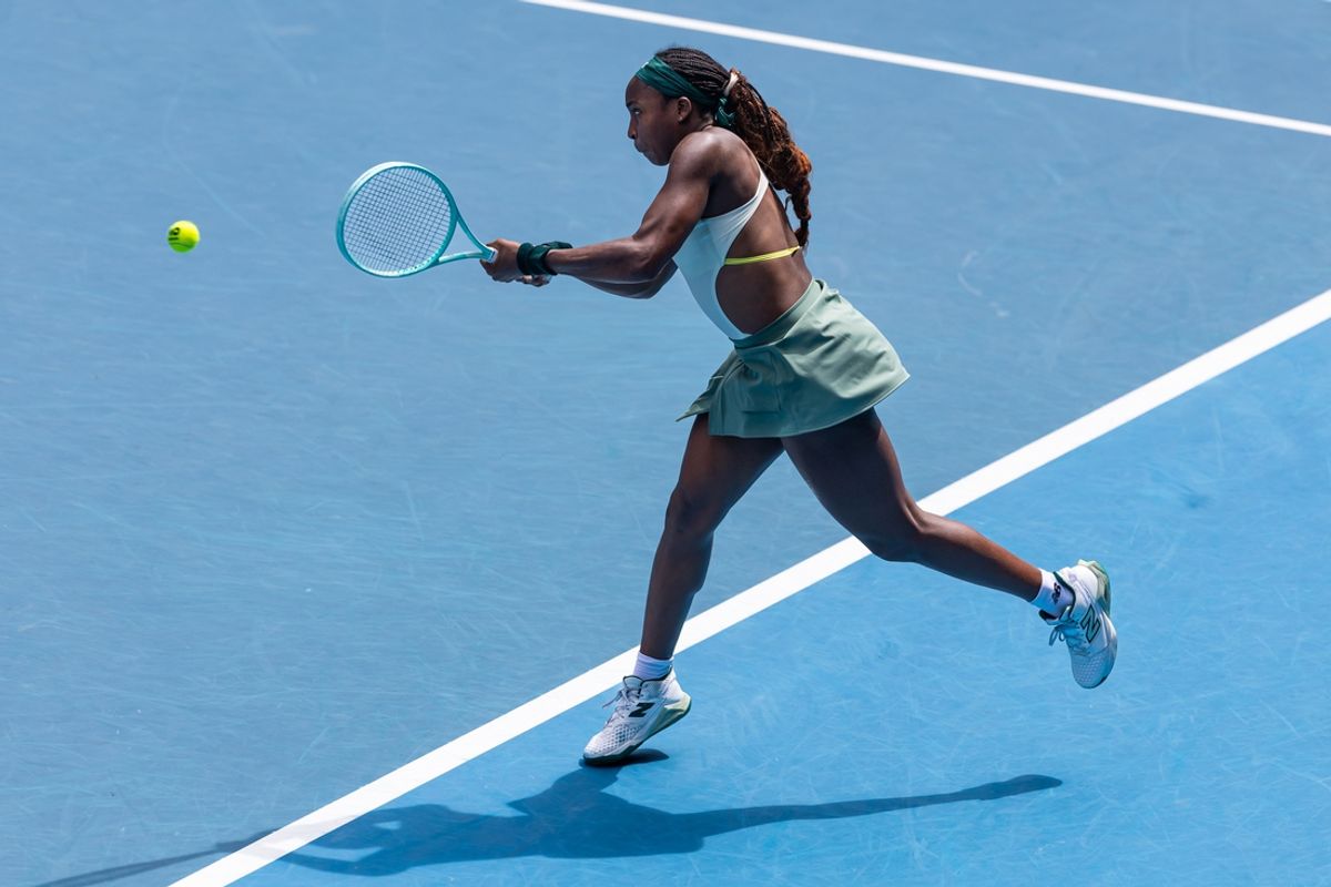 Jan 19, 2025; Melbourne, Victoria, Australia; Coco Gauff of United States of America plays a backhand during her match against Belinda Bencic of Switzerland in the fourth round of the women's singles at the 2025 Australian Open at Melbourne Park. Mandatory Credit: Mike Frey-Imagn Images