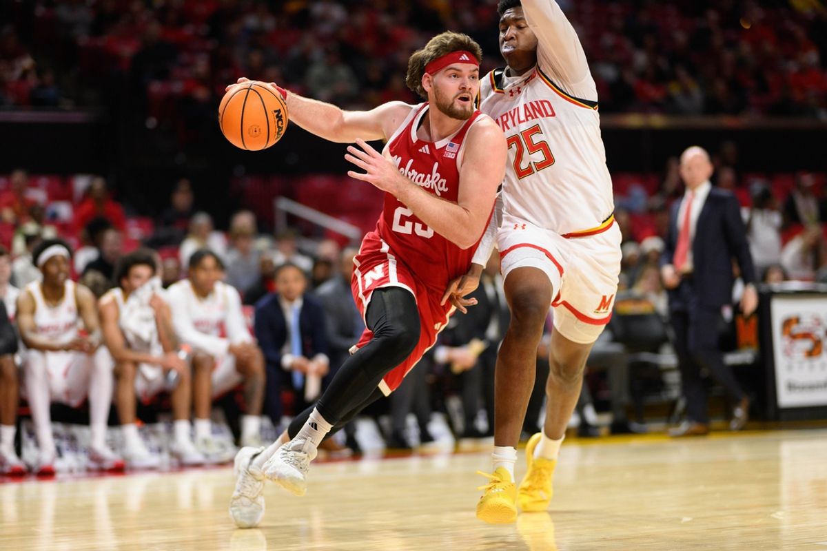 Jan 19, 2025; College Park, Maryland, USA; Nebraska Cornhuskers forward Andrew Morgan (23) drives to the basket against Maryland Terrapins center Derik Queen (25) during the first half at Xfinity Center. Mandatory Credit: Reggie Hildred-Imagn Images