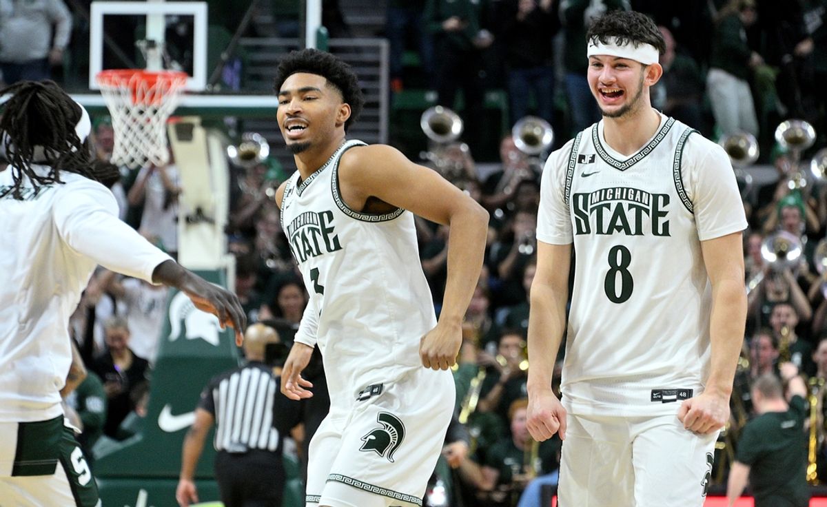 Jan 19, 2025; East Lansing, Michigan, USA;  Michigan State Spartans guard Jaden Akins (3) and forward Frankie Fidler (8) celebrate as the clock expires and the Michigan State Spartans defeat the Illinois Fighting Illini at Jack Breslin Student Events Center. Mandatory Credit: Dale Young-Imagn Images