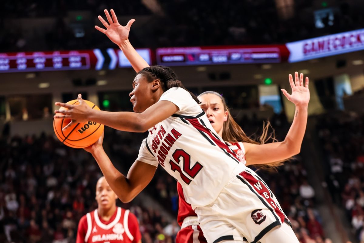 Jan 19, 2025; Columbia, South Carolina, USA; South Carolina Gamecocks guard MiLaysia Fulwiley (12) drives around Oklahoma Sooners guard Lexy Keys (15) in the first half at Colonial Life Arena. Mandatory Credit: Jeff Blake-Imagn Images
