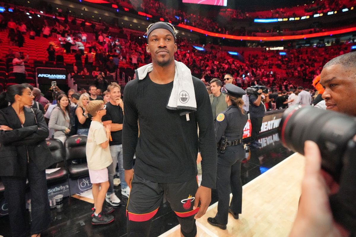 Jan 19, 2025; Miami, Florida, USA;  Miami Heat forward Jimmy Butler (22) walks off the court after greeting court-side friends following the victory over the San Antonio Spurs at Kaseya Center. Mandatory Credit: Jim Rassol-Imagn Images