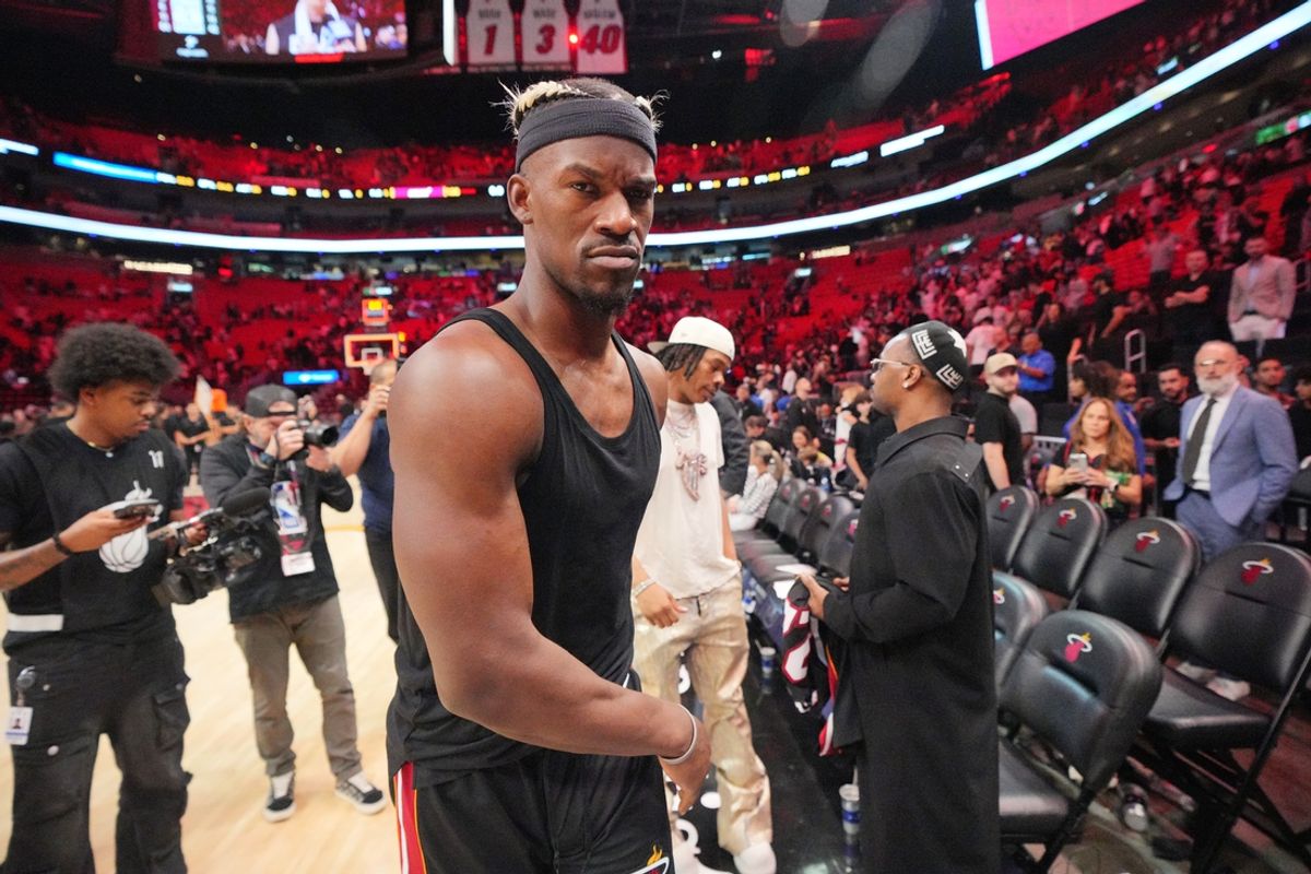 Jan 19, 2025; Miami, Florida, USA;  Miami Heat forward Jimmy Butler (22) walks off the court after greeting court-side friends following the victory over the San Antonio Spurs at Kaseya Center. Mandatory Credit: Jim Rassol-Imagn Images