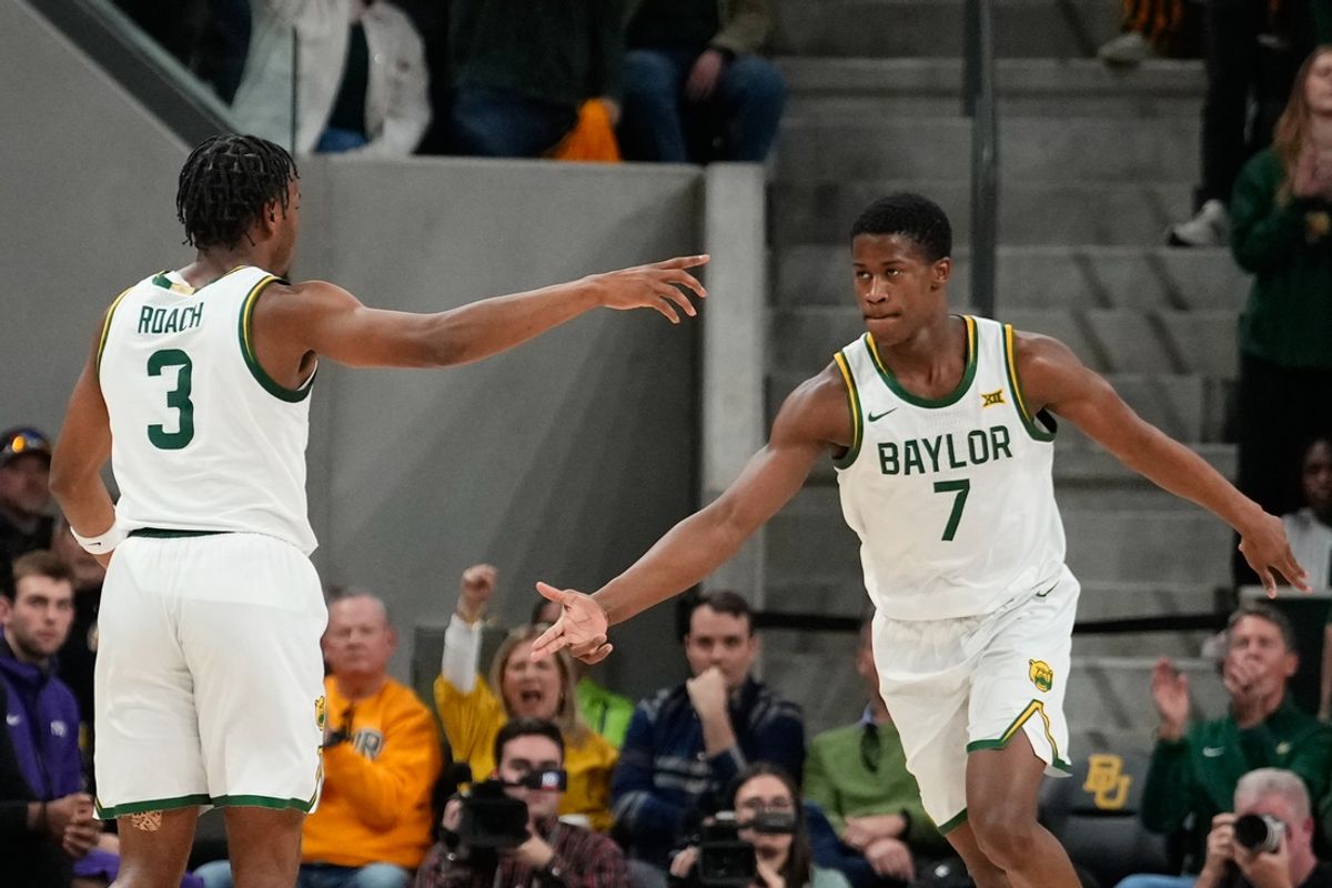 Jan 19, 2025; Waco, Texas, USA;  Baylor Bears guard VJ Edgecombe (7) celebrates with Baylor Bears guard Jeremy Roach (3) after a play against the TCU Horned Frogs during the first half at Paul and Alejandra Foster Pavilion. Mandatory Credit: Chris Jones-Imagn Images