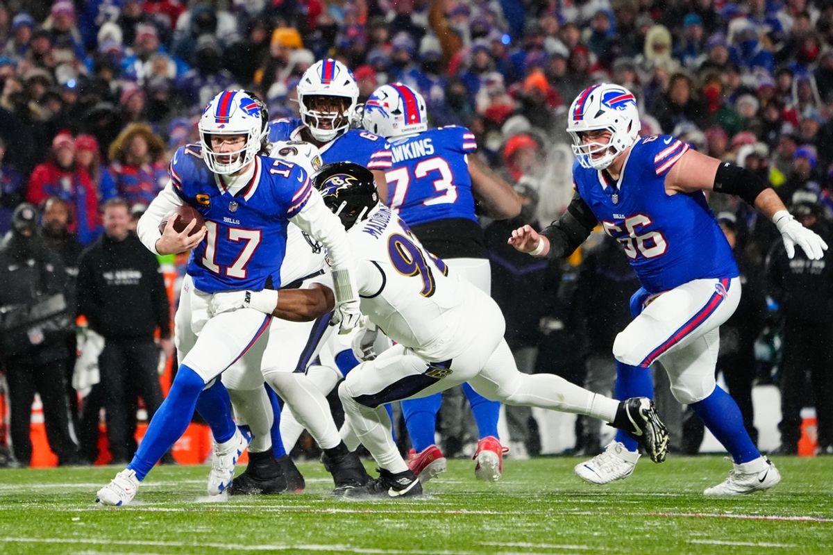 Jan 19, 2025; Orchard Park, New York, USA; Buffalo Bills quarterback Josh Allen (17) runs the ball during the first quarter against the Baltimore Ravens in a 2025 AFC divisional round game at Highmark Stadium. Mandatory Credit: Gregory Fisher-Imagn Images