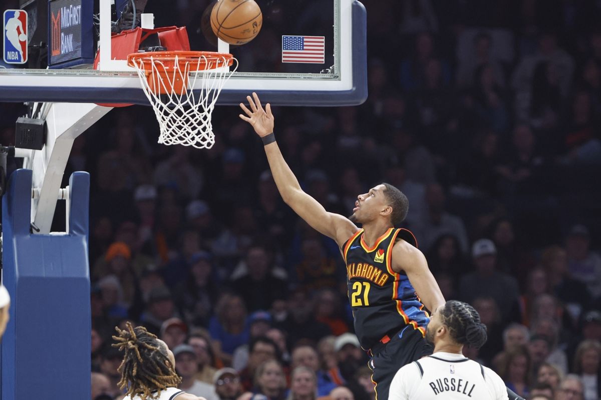 Jan 19, 2025; Oklahoma City, Oklahoma, USA; Oklahoma City Thunder guard Aaron Wiggins (21) goes up for a basket against the Brooklyn Nets during the second quarter at Paycom Center. Mandatory Credit: Alonzo Adams-Imagn Images