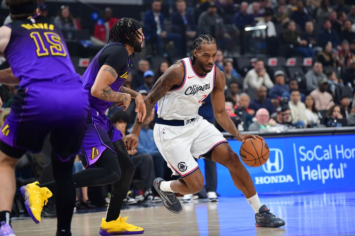 Jan 19, 2025; Inglewood, California, USA;  Los Angeles Clippers forward Kawhi Leonard (2) moves the ball against Los Angeles Lakers forward Anthony Davis (3) during the first half at Intuit Dome. Mandatory Credit: Gary A. Vasquez-Imagn Images