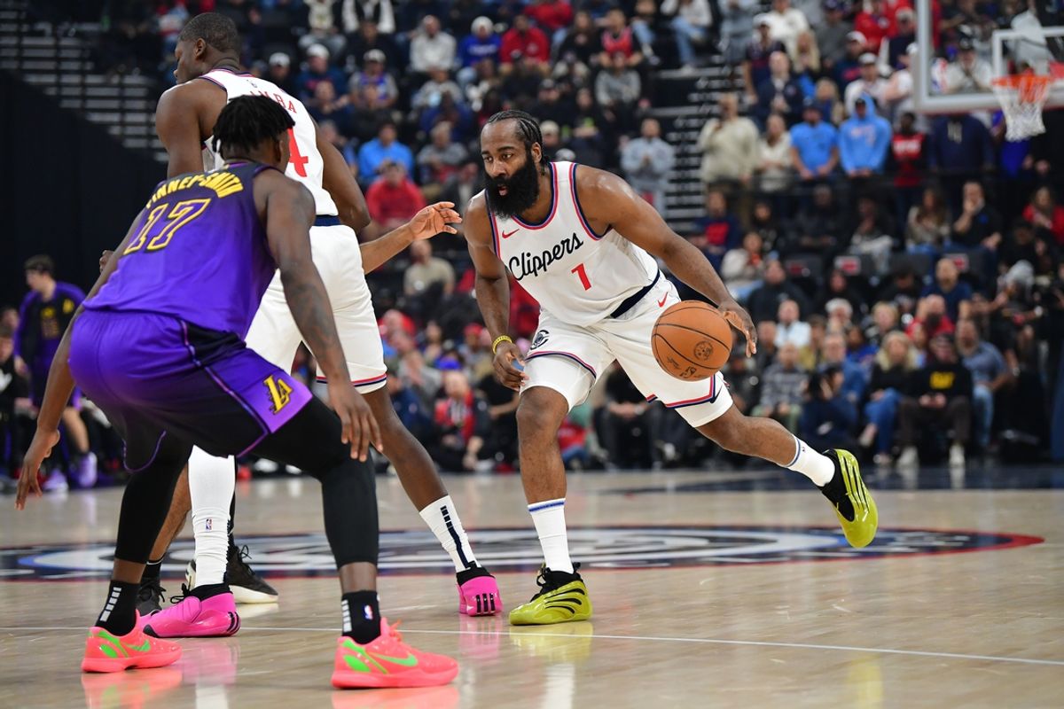 Jan 19, 2025; Inglewood, California, USA; Los Angeles Clippers guard James Harden (1) controls the ball against Los Angeles Lakers forward Dorian Finney-Smith (17) during the first half at Intuit Dome. Mandatory Credit: Gary A. Vasquez-Imagn Images