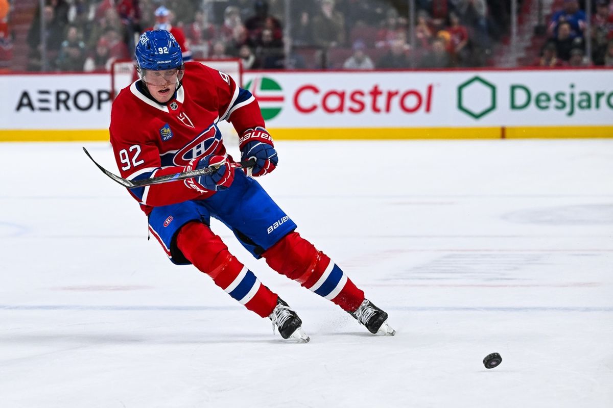 Jan 19, 2025; Montreal, Quebec, CAN; Montreal Canadiens right wing Patrik Laine (92) plays the puck against the New York Rangers during overtime at Bell Centre. Mandatory Credit: David Kirouac-Imagn Images