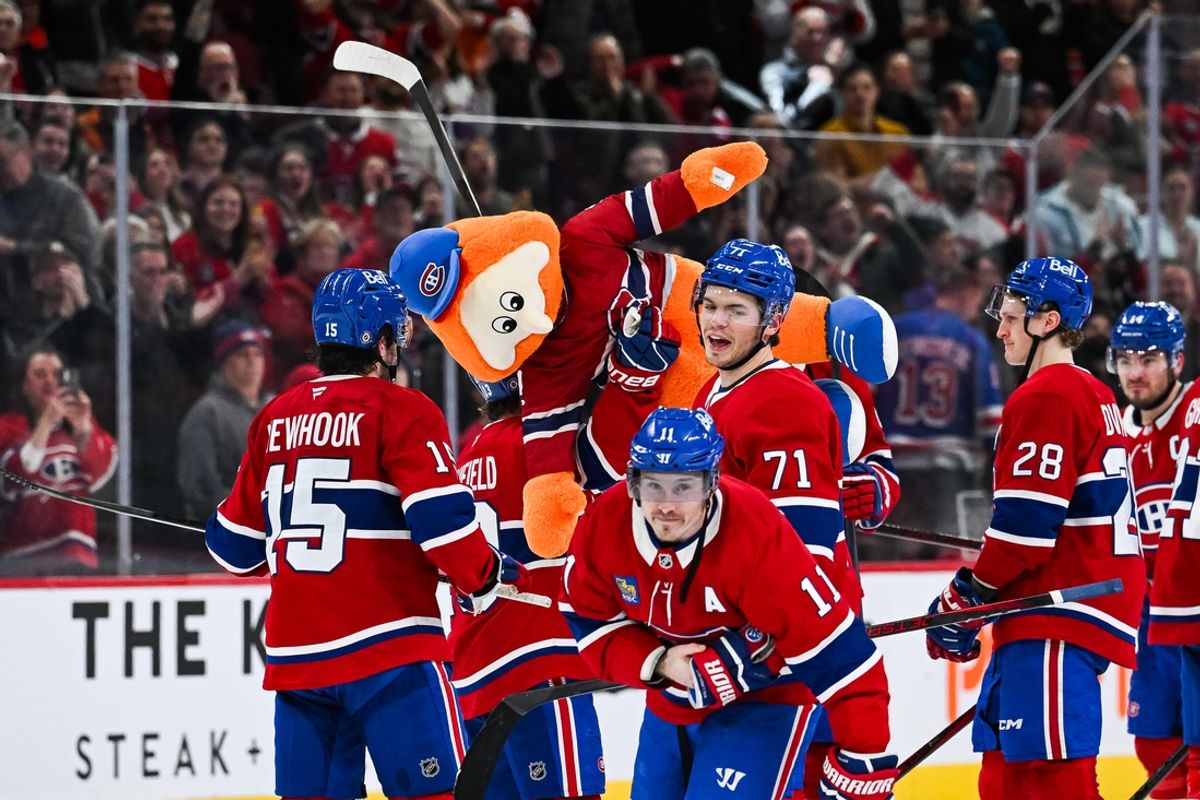Jan 19, 2025; Montreal, Quebec, CAN; Montreal Canadiens players celebrate the win with a stuffed version of mascot Youppi after the game against the New York Rangers at Bell Centre. Mandatory Credit: David Kirouac-Imagn Images