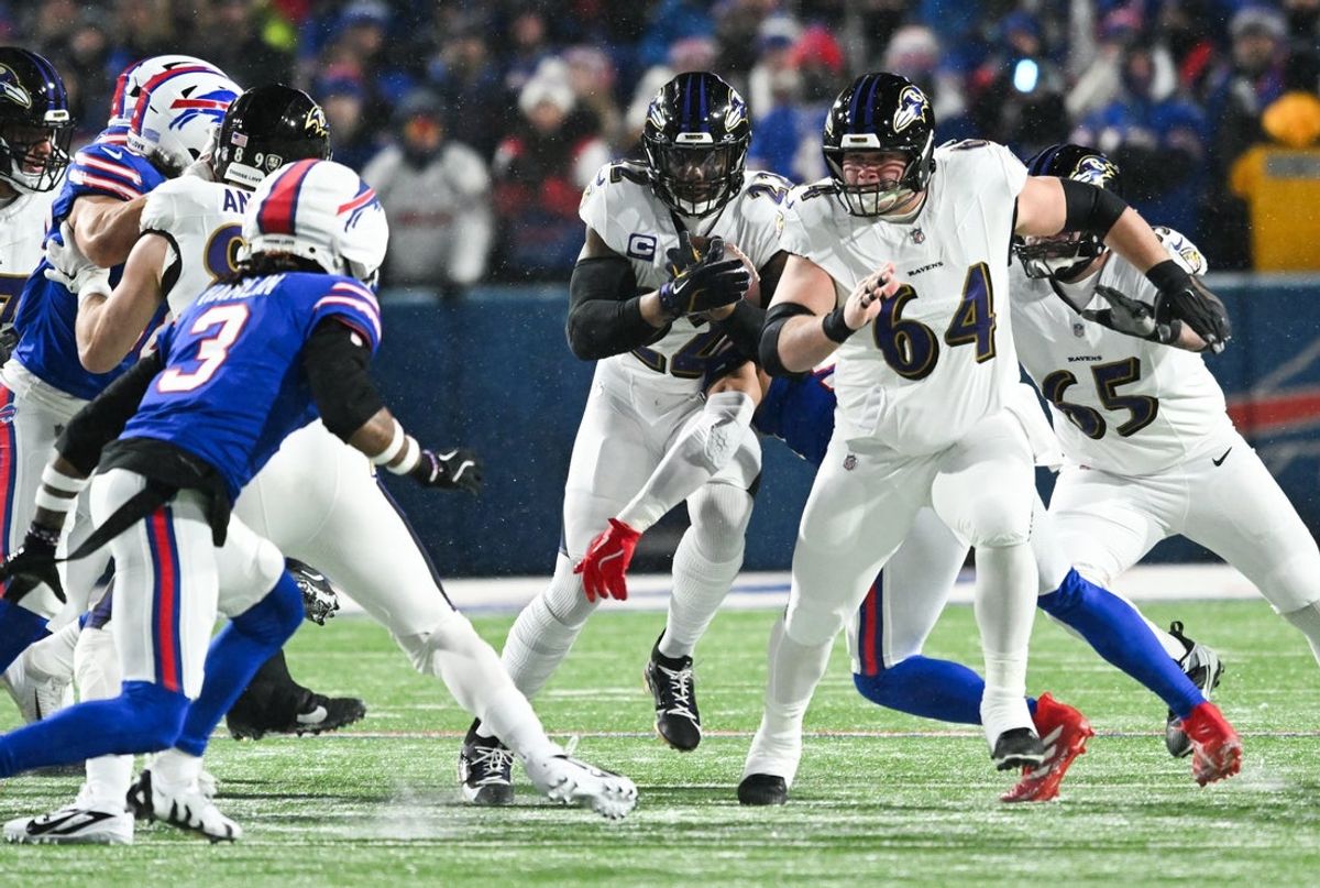 Jan 19, 2025; Orchard Park, New York, USA; Baltimore Ravens running back Derrick Henry (22) runs the ball during the first quarter against the Buffalo Bills in a 2025 AFC divisional round game at Highmark Stadium. Mandatory Credit: Mark Konezny-Imagn Images