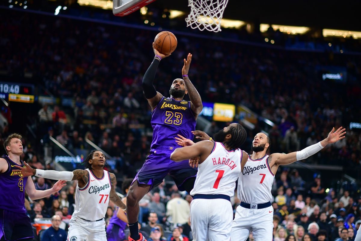 Jan 19, 2025; Inglewood, California, USA; Los Angeles Lakers forward LeBron James (23) shoots against Los Angeles Clippers guard James Harden (1) and guard Amir Coffey (7) during the second half at Intuit Dome. Mandatory Credit: Gary A. Vasquez-Imagn Images