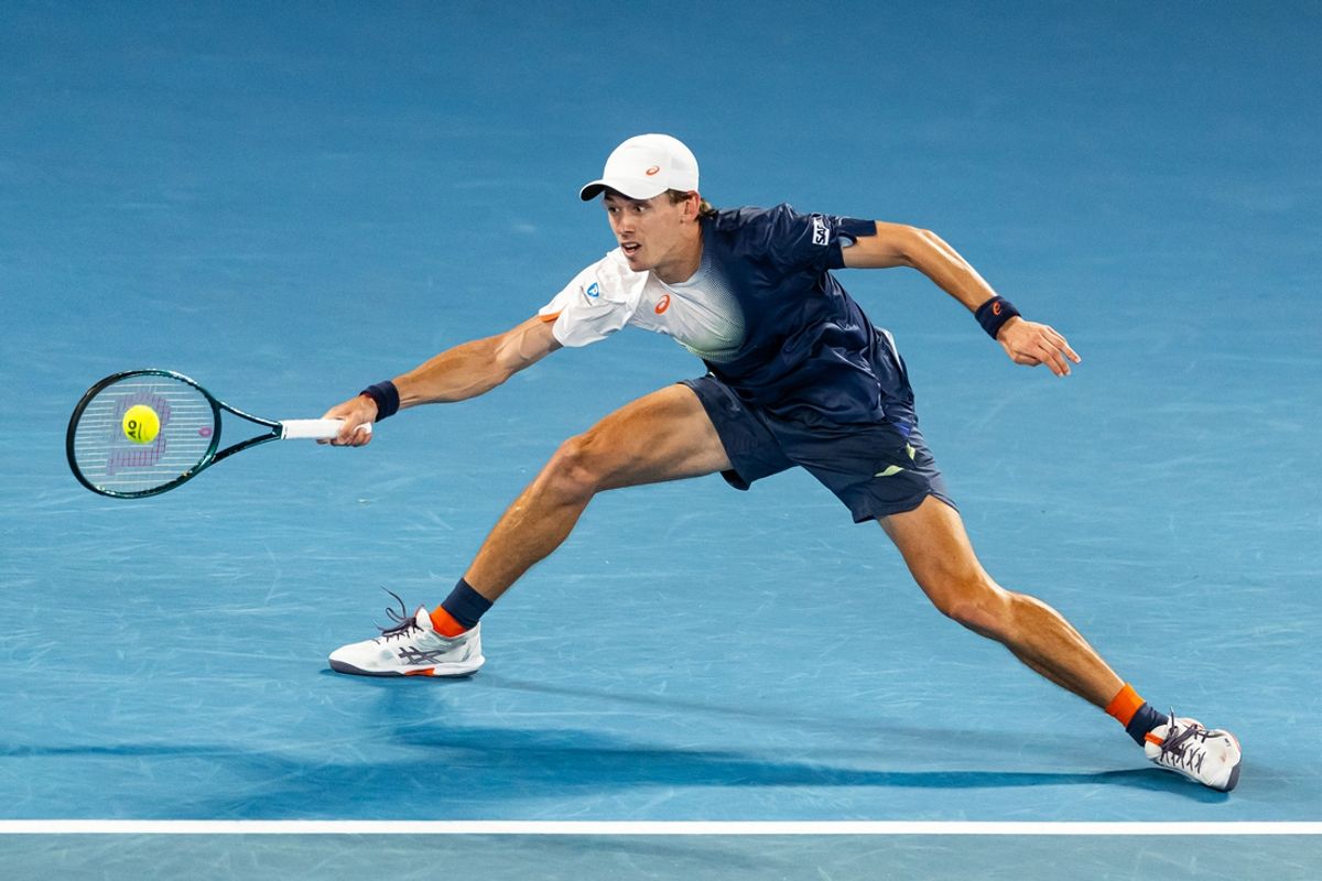 Jan 20, 2025; Melbourne, Victoria, Australia; Alex de Minaur of Australia hits a forehand during his match against Alex Michelsen of United States of America in the fourth round of the men's singles at the 2025 Australian Open at Melbourne Park. Mandatory Credit: Mike Frey-Imagn Images