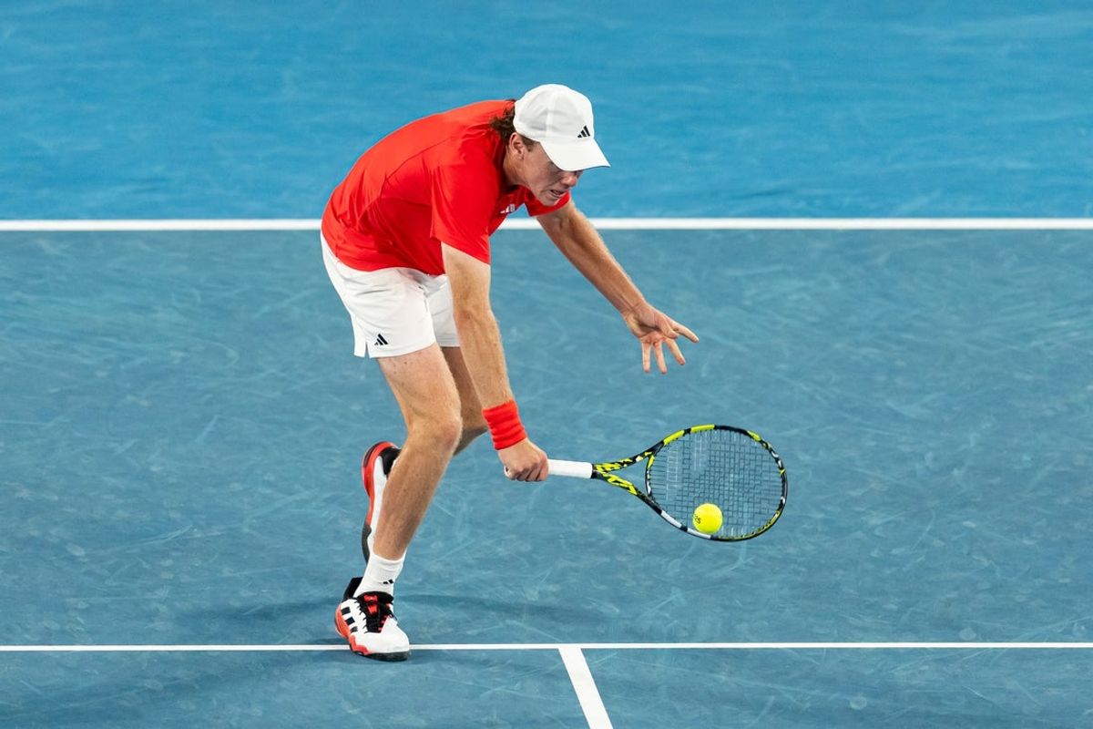 Jan 20, 2025; Melbourne, Victoria, Australia; Alex Michelsen of United States of America plays a backhand during his match against Alex de Minaur of Australia in the fourth round of the men's singles at the 2025 Australian Open at Melbourne Park. Mandatory Credit: Mike Frey-Imagn Images