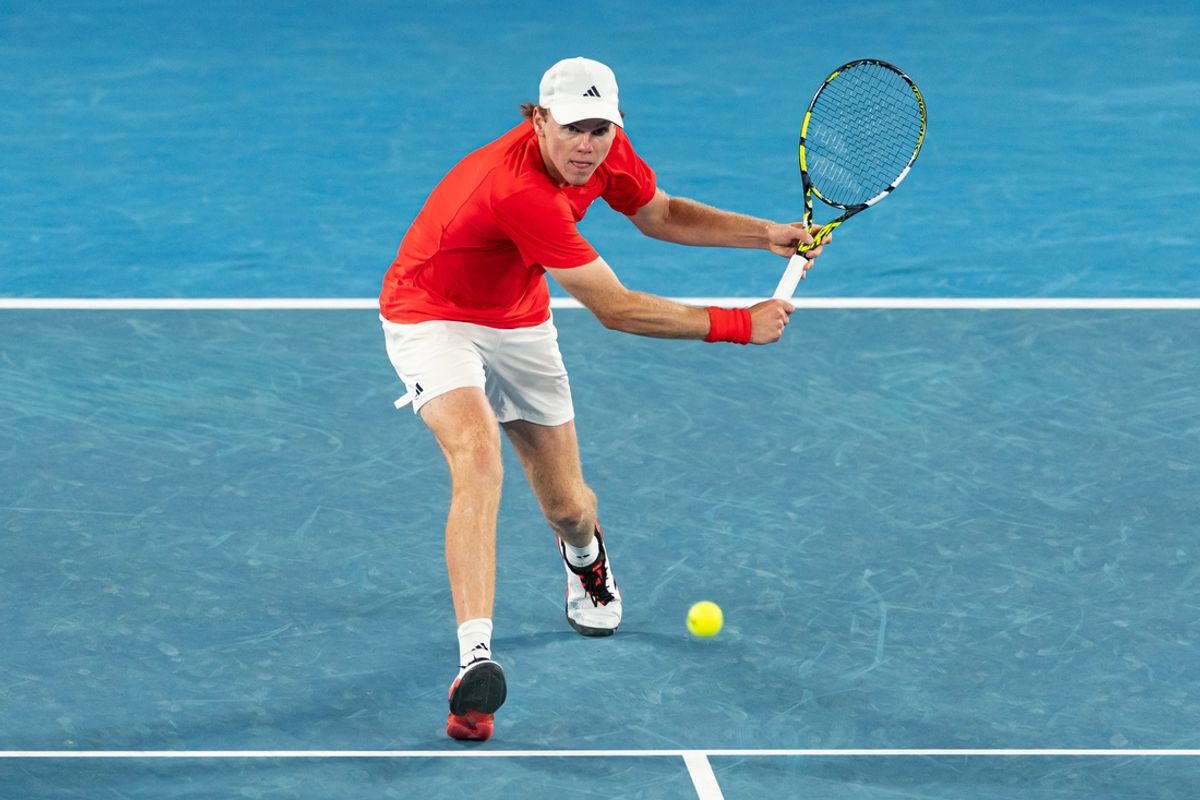Jan 20, 2025; Melbourne, Victoria, Australia; Alex Michelsen of United States of America plays a backhand during his match against Alex de Minaur of Australia in the fourth round of the men's singles at the 2025 Australian Open at Melbourne Park. Mandatory Credit: Mike Frey-Imagn Images