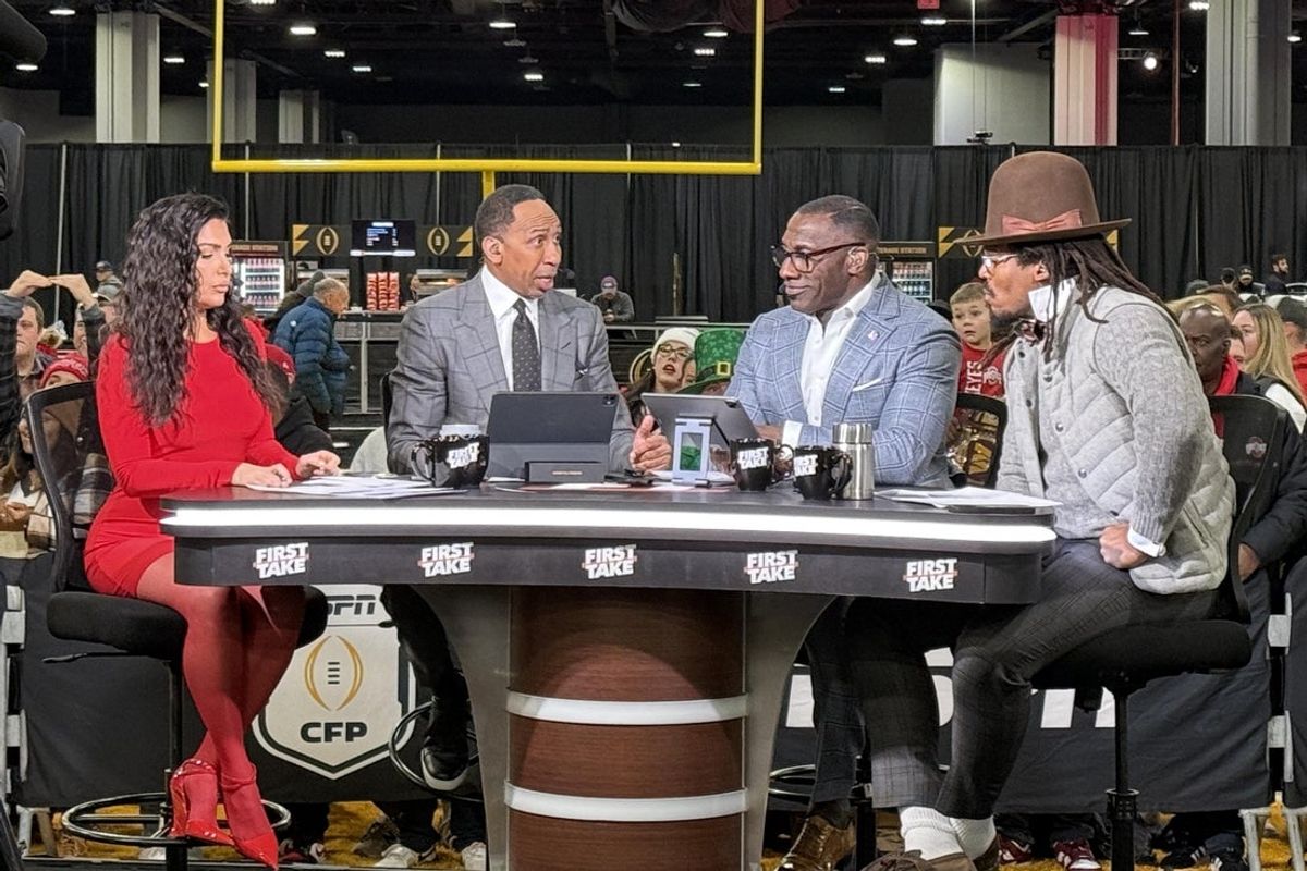 Jan 20, 2025; Atlanta, GA, USA; The hosts of ESPN First Take, Molly Qerim, Stephen A. Smith, Shannon Sharpe and Cam Newton, at the CFP Fan Central at the George World Congress Center. Mandatory Credit: Kirby Lee-Imagn Images