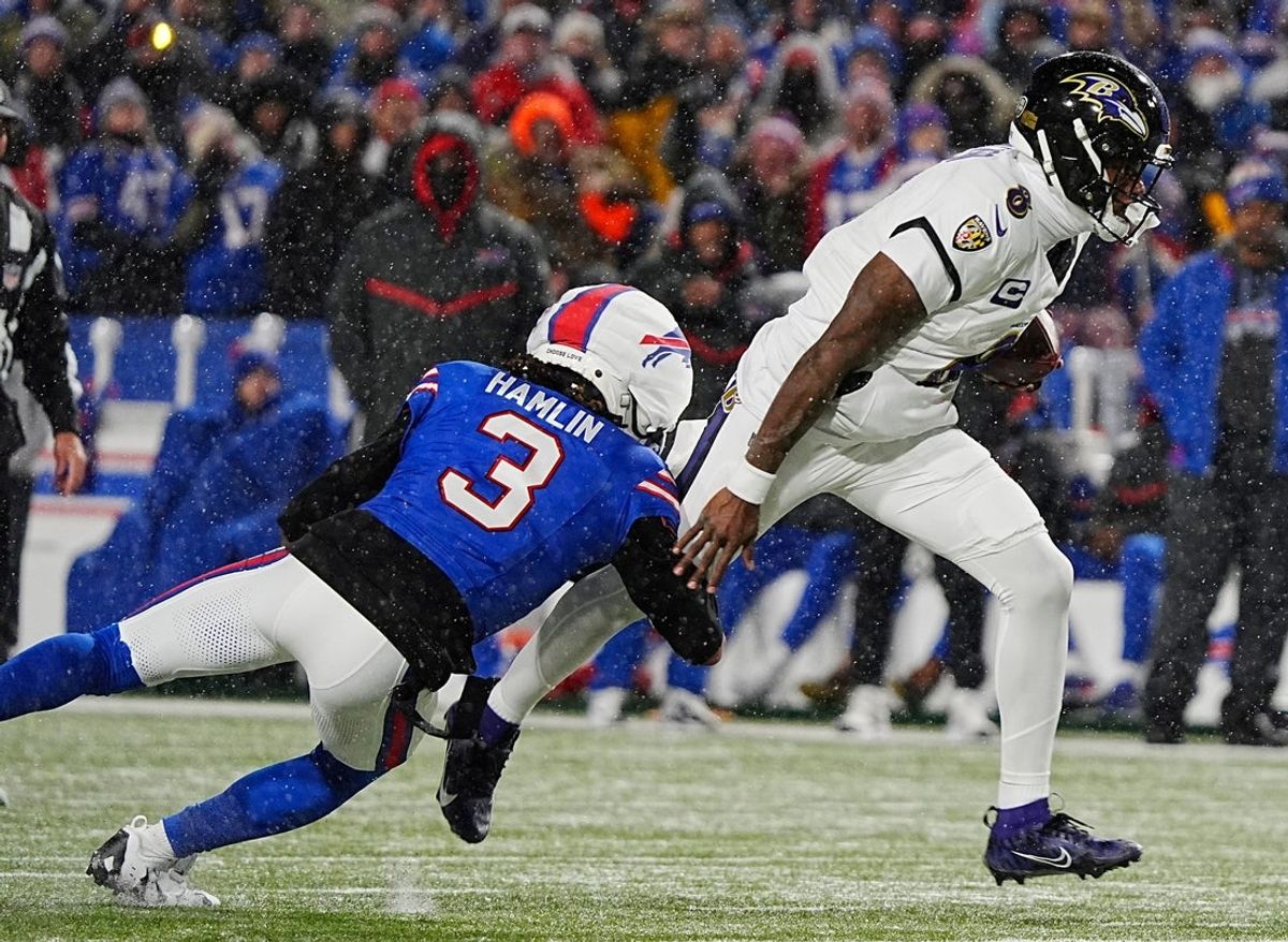Buffalo Bills safety Damar Hamlin grabs a hold of Baltimore Ravens quarterback Lamar Jackson’s leg and sacks him causing a fumble that Bills Von Miller picked up and ran for about 39 yards with during first half action at the Buffalo Bills divisional game against the Baltimore Ravens at Highmark Stadium in Orchard Park on Jan. 19, 2025.