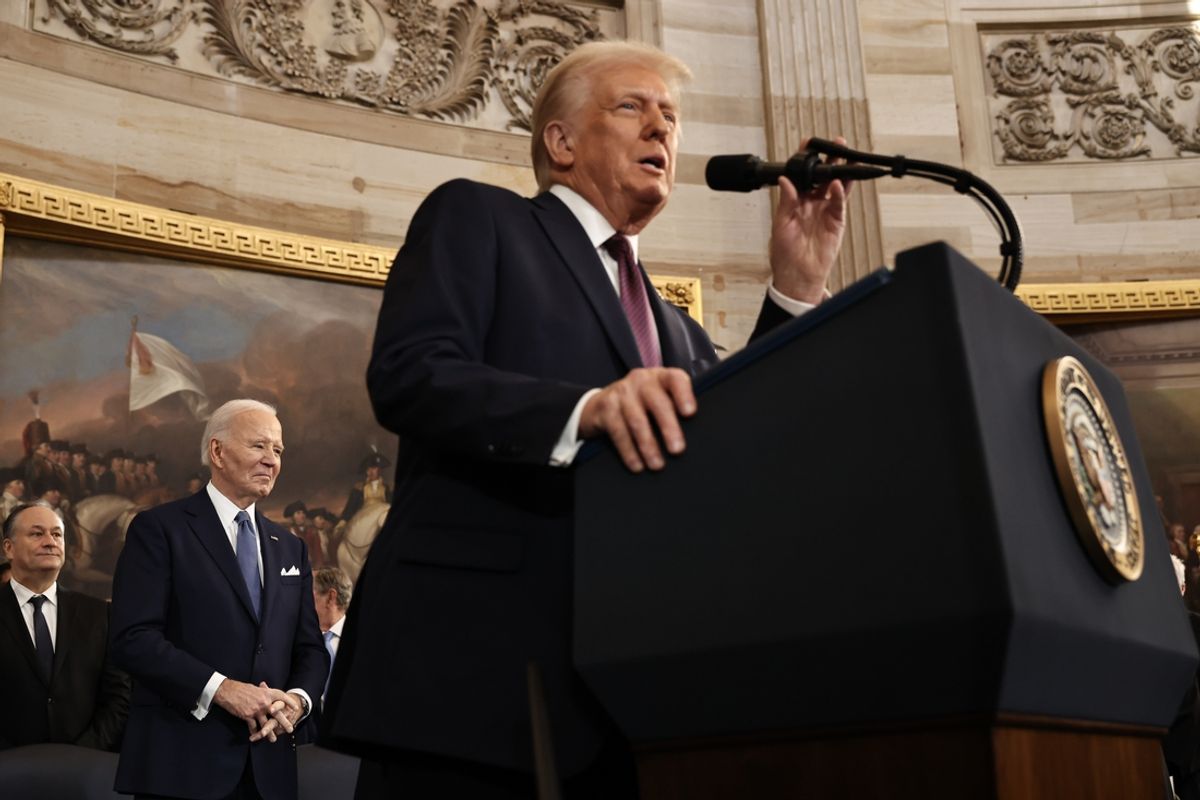 Jan 20, 2025; Washington, DC, USA; U.S. President Donald Trump speaks as former U.S. President Joe Biden looks on during inauguration ceremonies in the Rotunda of the U.S. Capitol on January 20, 2025 in Washington, DC. Donald Trump takes office for his second term as the 47th president of the United States. Mandatory Credit: Chip Somodevilla-Pool via Imagn Images