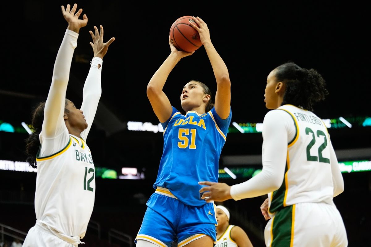 Jan 20, 2025; Newark, New Jersey, USA;  UCLA Bruins center Lauren Betts (51) scores a basket against Baylor Lady Bears forward Kyla Abraham (12) during the second half at Prudential Center. Mandatory Credit: Chris Jones-Imagn Images