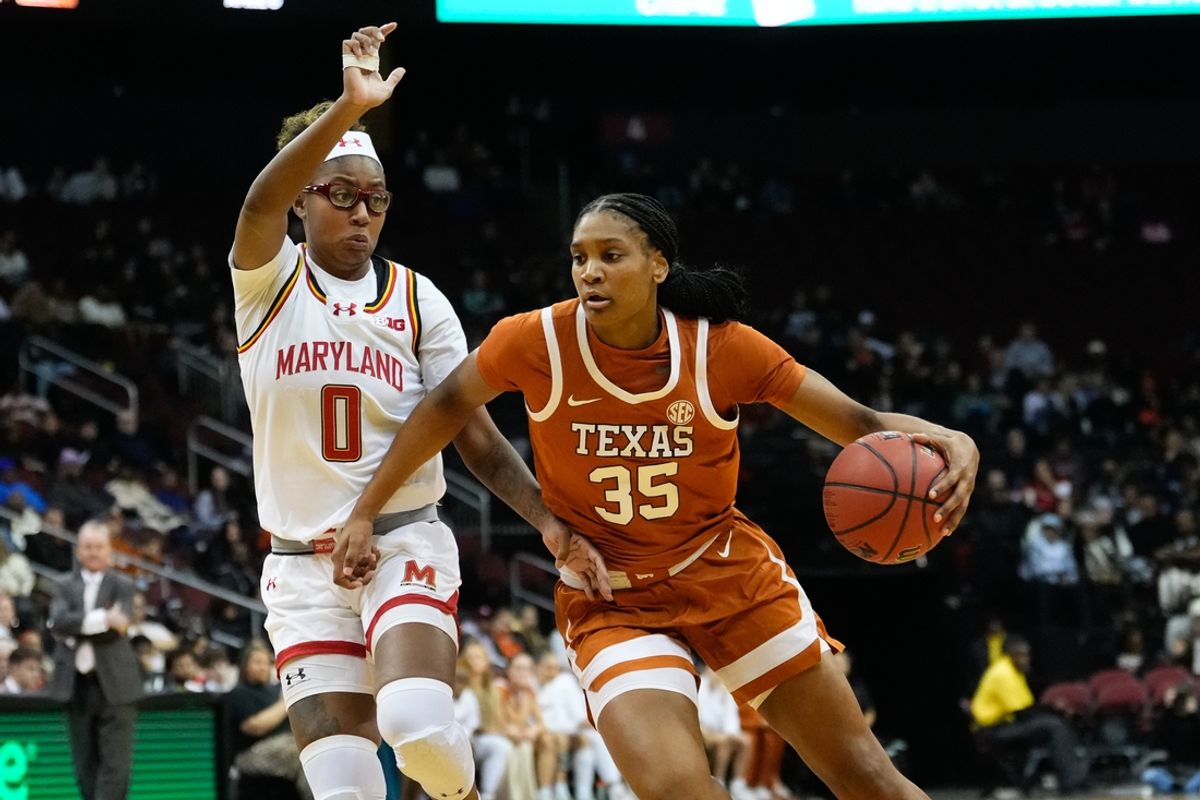 Jan 20, 2025; Newark, New Jersey, USA;  Texas Longhorns forward Madison Booker (35) drives to the basket as Maryland Terrapins guard Shyanne Sellers (0) defends during the first half at Prudential Center. Mandatory Credit: Chris Jones-Imagn Images