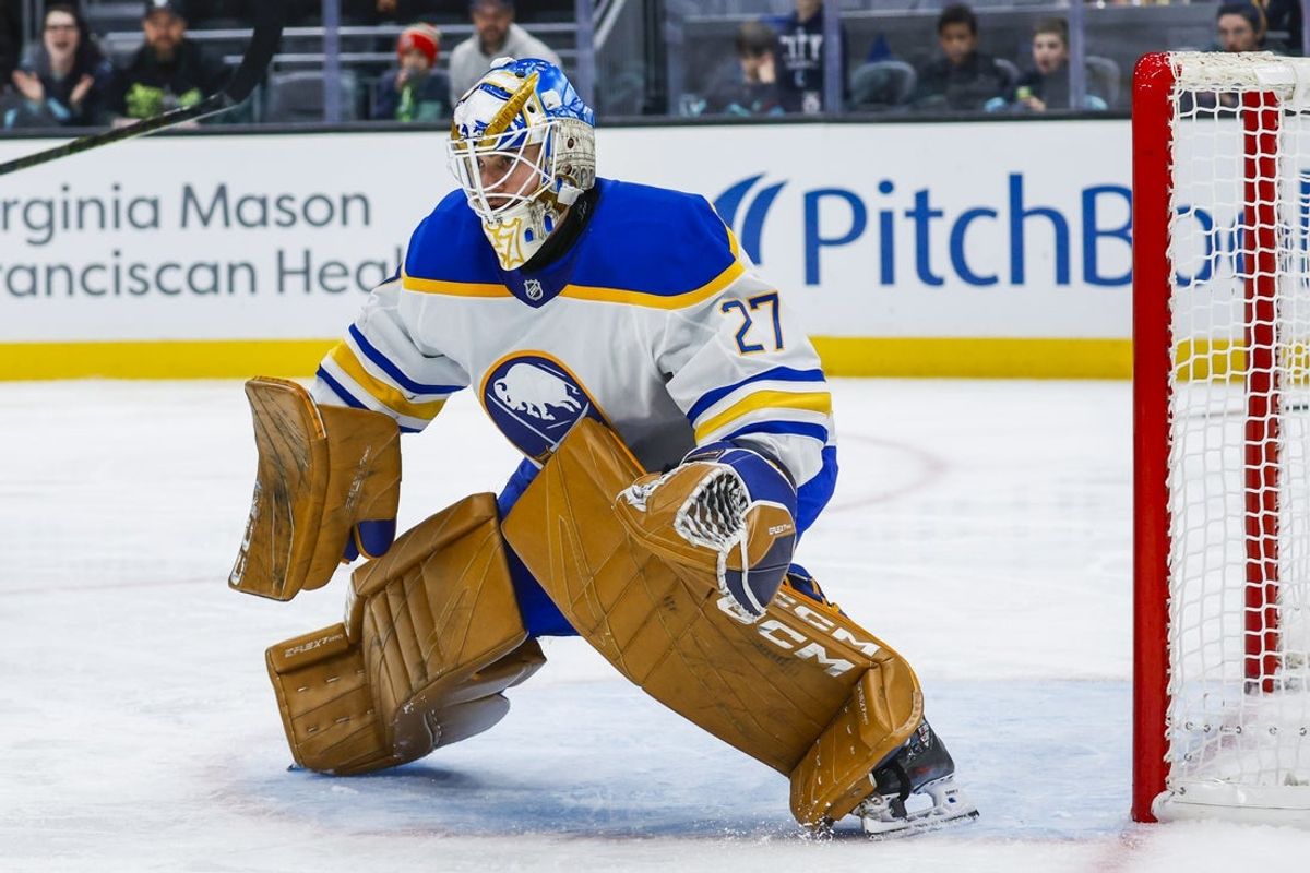 Jan 20, 2025; Seattle, Washington, USA; Buffalo Sabres goaltender Devon Levi (27) defends the net without a stick against the Seattle Kraken during the third period at Climate Pledge Arena. Mandatory Credit: Joe Nicholson-Imagn Images