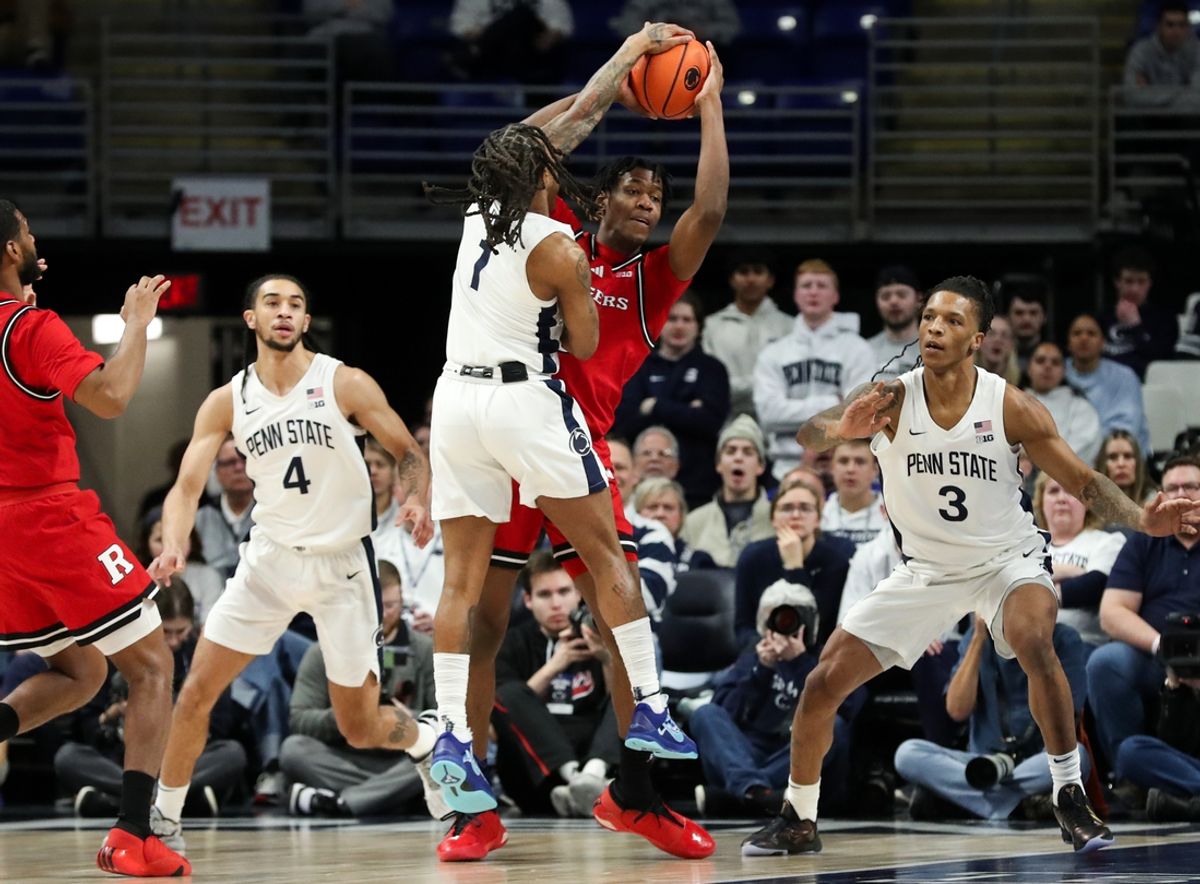 Jan 20, 2025; University Park, Pennsylvania, USA; Rutgers Scarlet Knights forward Dylan Grant (9) looks to pass the ball as Penn State Nittany Lions guard Ace Baldwin Jr (1) defends during the first half at Bryce Jordan Center. Mandatory Credit: Matthew O'Haren-Imagn Images