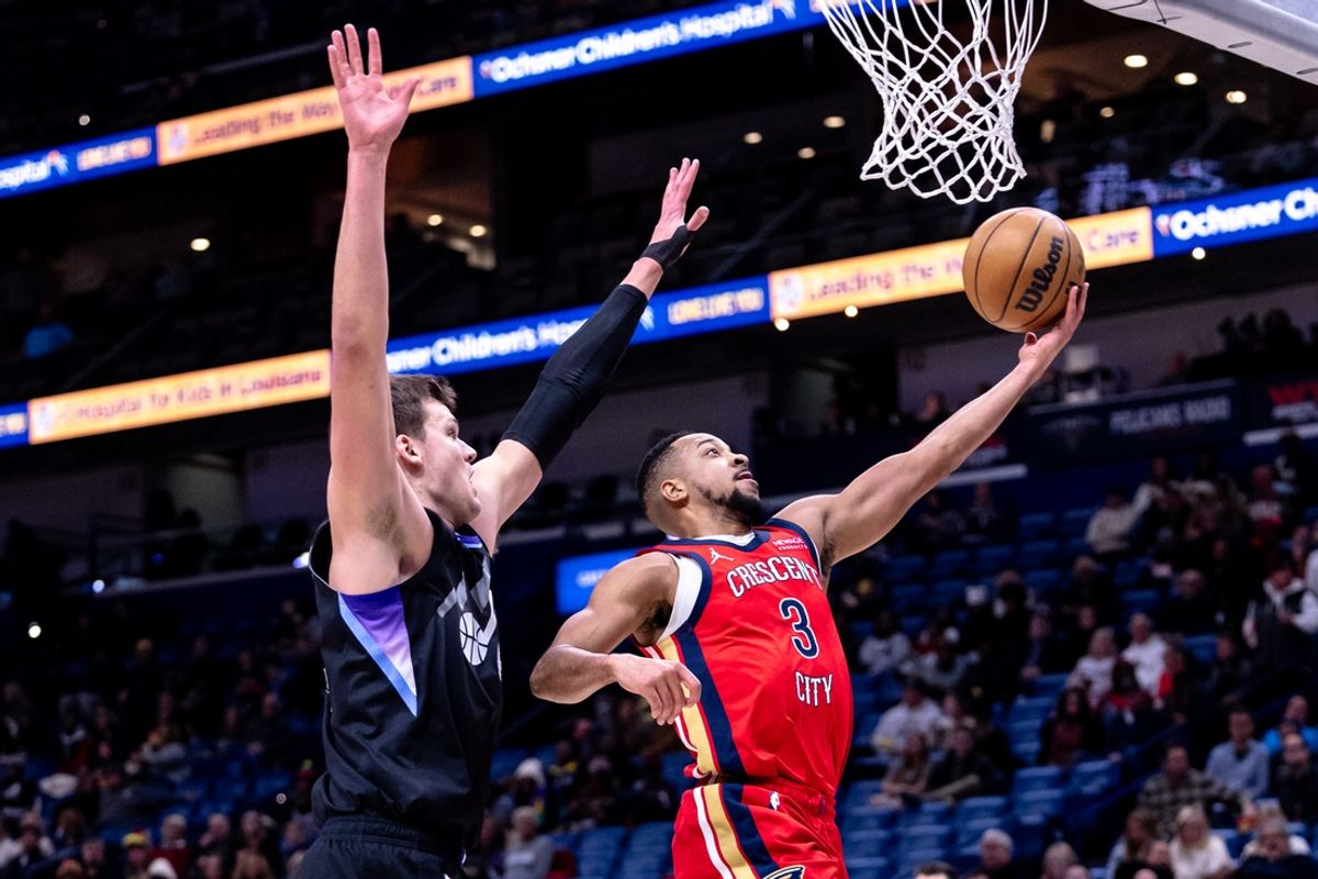 Jan 20, 2025; New Orleans, Louisiana, USA;  New Orleans Pelicans guard CJ McCollum (3) drives to the basket against Utah Jazz center Walker Kessler (24) during the first half at Smoothie King Center. Mandatory Credit: Stephen Lew-Imagn Images