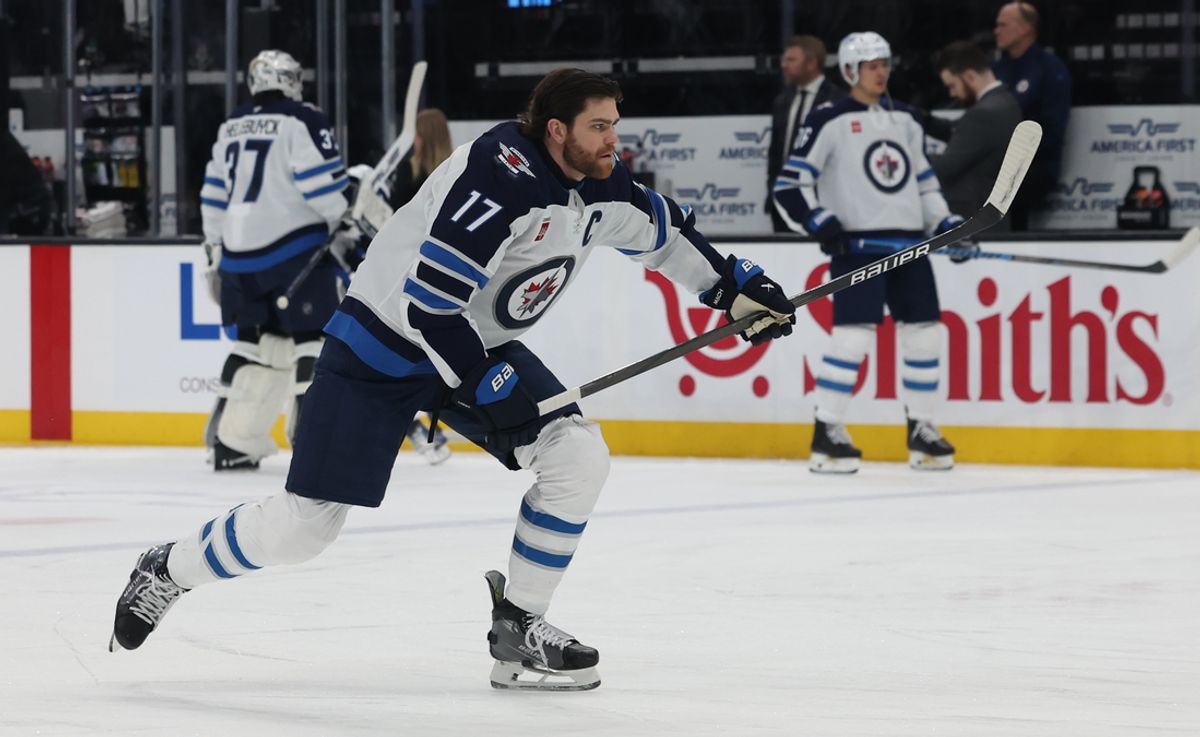 Jan 20, 2025; Salt Lake City, Utah, USA; Winnipeg Jets center Adam Lowry (17) warms up before a game against the Utah Hockey Club Delta Center. Mandatory Credit: Rob Gray-Imagn Images