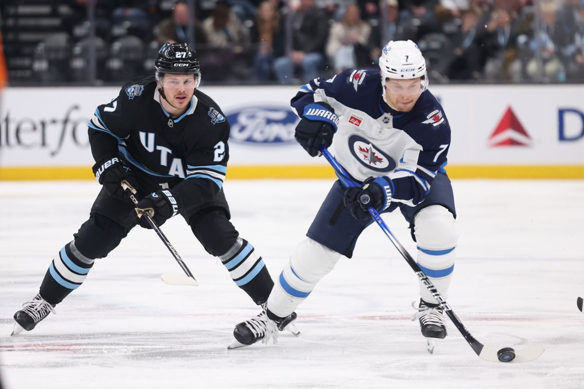 Jan 20, 2025; Salt Lake City, Utah, USA; Winnipeg Jets center Vladislav Namestnikov (7) skates against Utah Hockey Club center Barrett Hayton (27) during the first period at Delta Center. Mandatory Credit: Rob Gray-Imagn Images