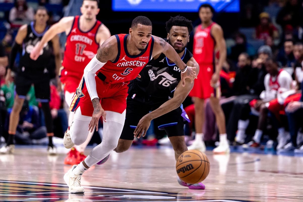 Jan 20, 2025; New Orleans, Louisiana, USA;  New Orleans Pelicans guard Dejounte Murray (5) brings the ball up court against Utah Jazz guard Elijah Harkness during the second half at Smoothie King Center. Mandatory Credit: Stephen Lew-Imagn Images