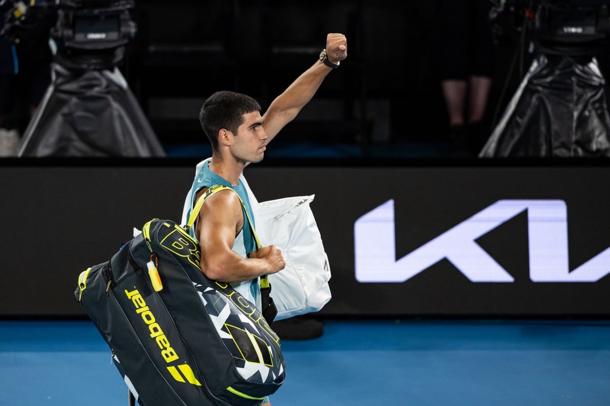 Jan 22, 2025; Melbourne, Victoria, Australia; Carlos Alcaraz of Spain gestures during his match against Novak Djokovic of Serbia in the quarterfinals of the men's singles at the 2025 Australian Open at Melbourne Park. Mandatory Credit: Mike Frey-Imagn Images