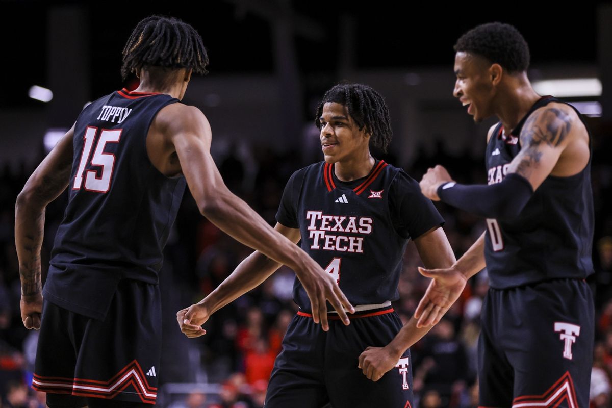 Jan 21, 2025; Cincinnati, Ohio, USA; Texas Tech Red Raiders forward JT Toppin (15) reacts after a play with guard Christian Anderson (4) and guard Chance McMillian (0) in the second half against the Cincinnati Bearcats at Fifth Third Arena. Mandatory Credit: Katie Stratman-Imagn Images